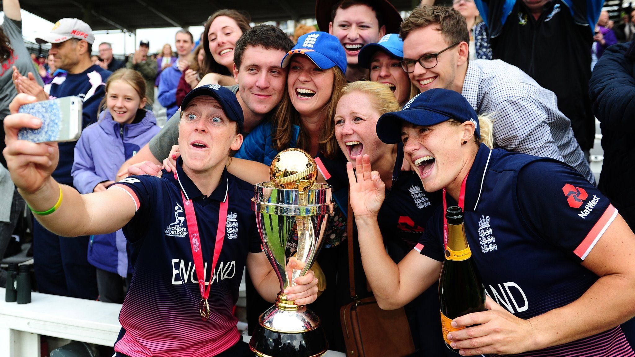 Heather Knight and Katherine Brunt celebrate with England fans