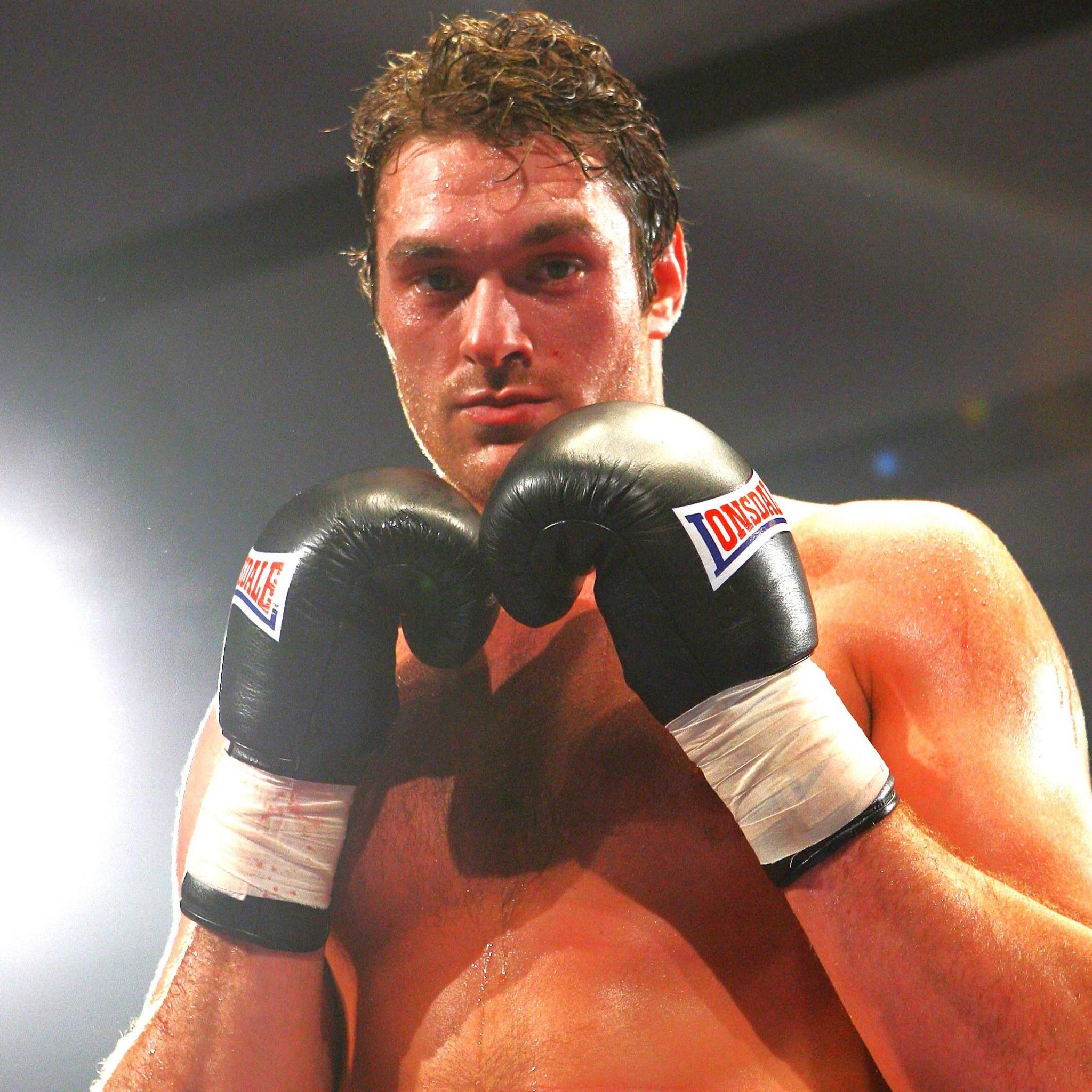 Tyson Fury poses with his gloves high around his chin