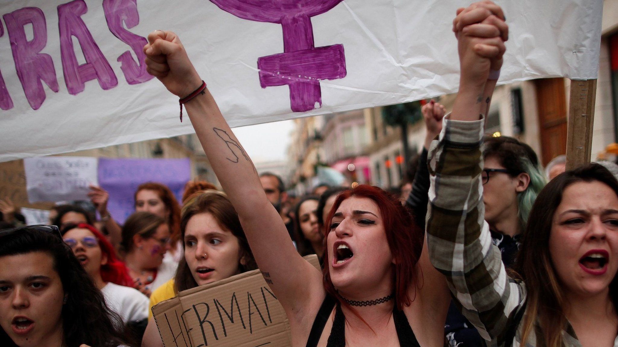 People shout slogans during a protest