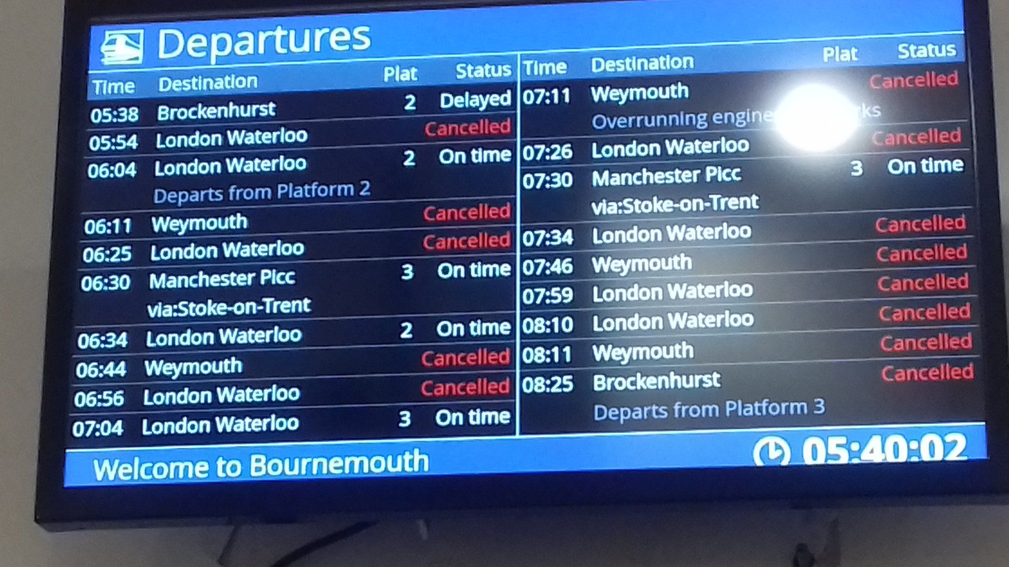 Departure boards showing delayed or cancelled messages