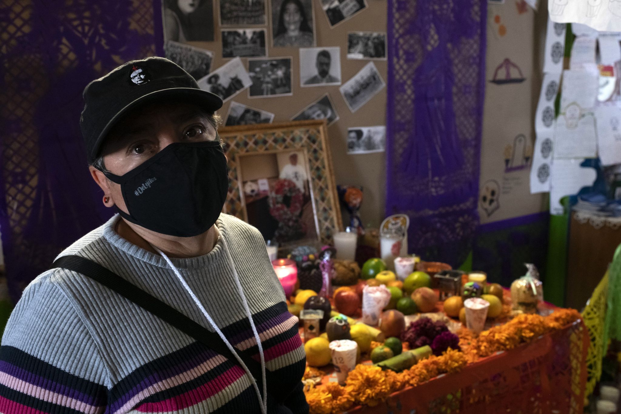 Elvira Madrid Romero in front of the offering for Jaime Alberto Montejo, who founded the organisation Brigada Callejera, which supports female sex workers