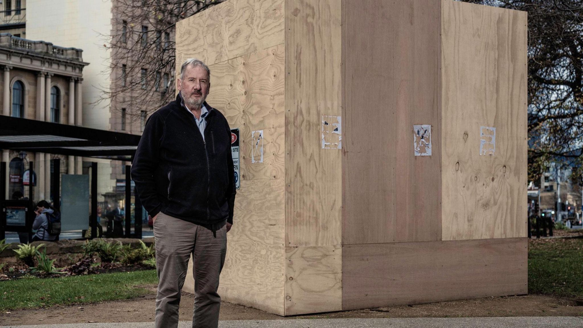 Jeff Briscoe stands in front of the boxed up Crowther statue