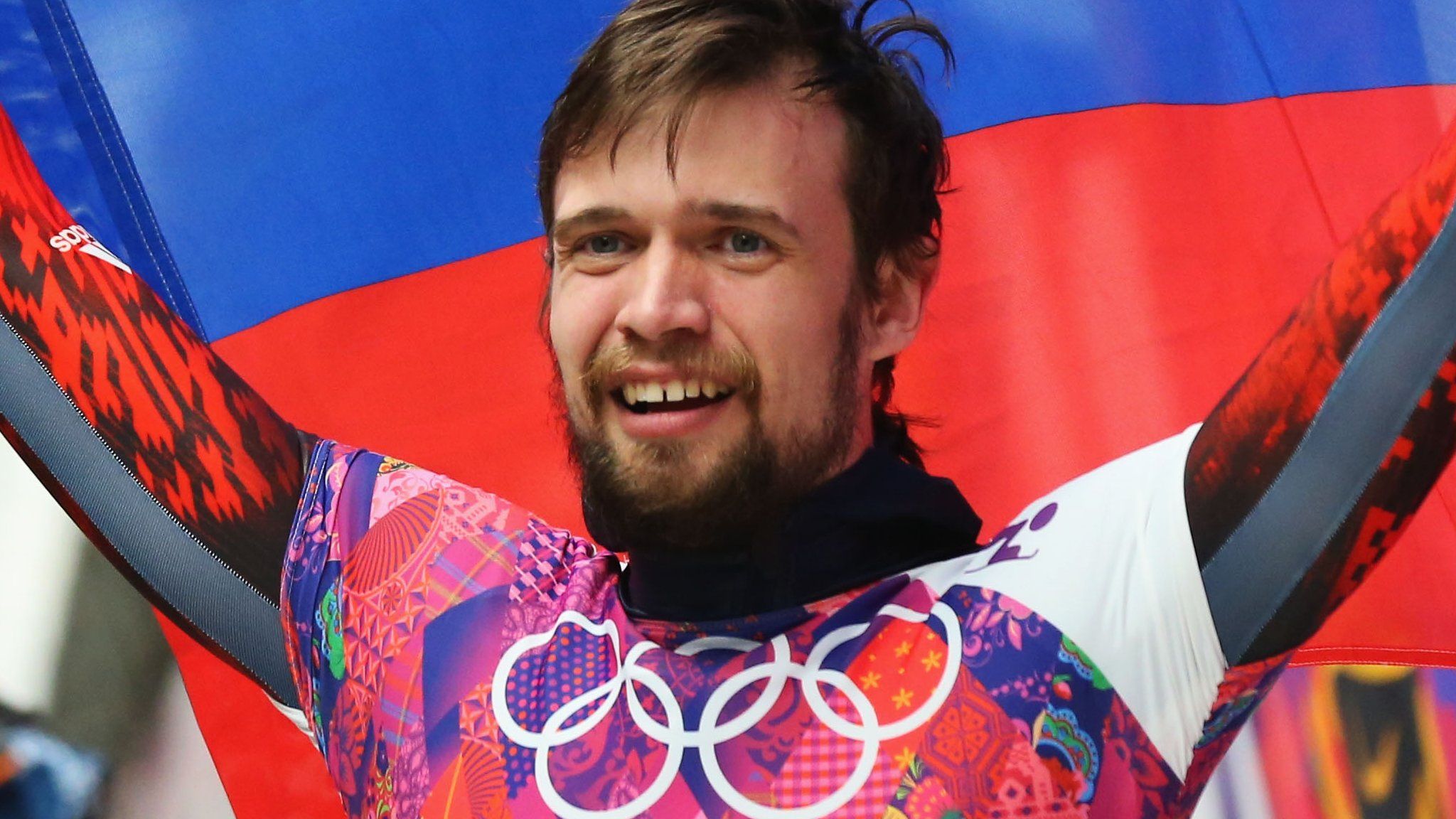Russia's Alexander Tretiakov celebrates winning gold at Sochi