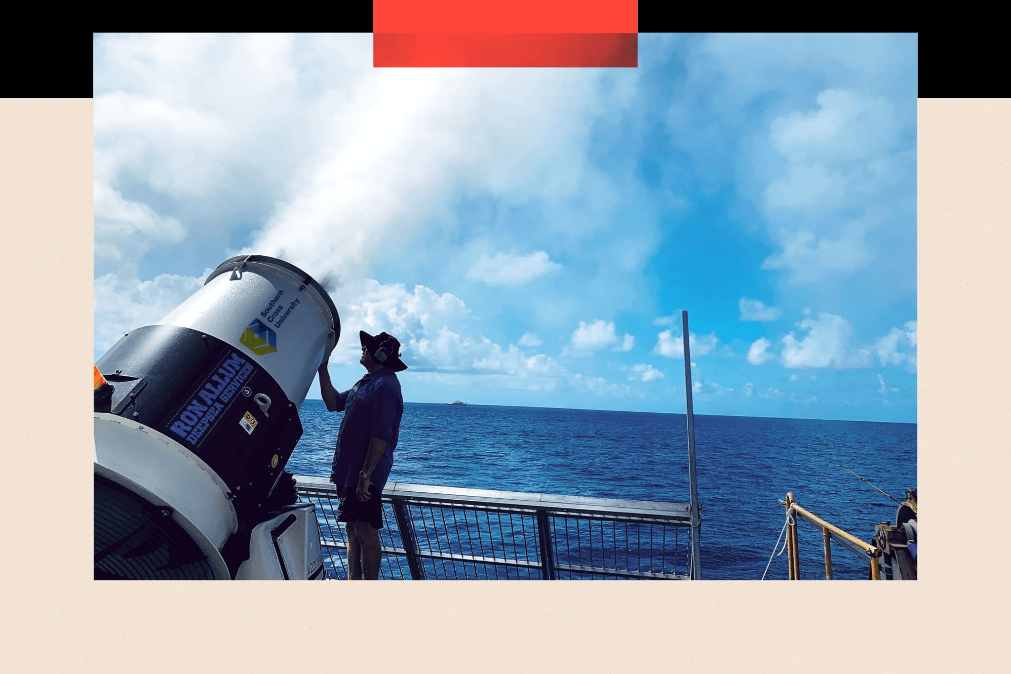 A large cylindrical machine sprays salt water up towards the clouds from a boat