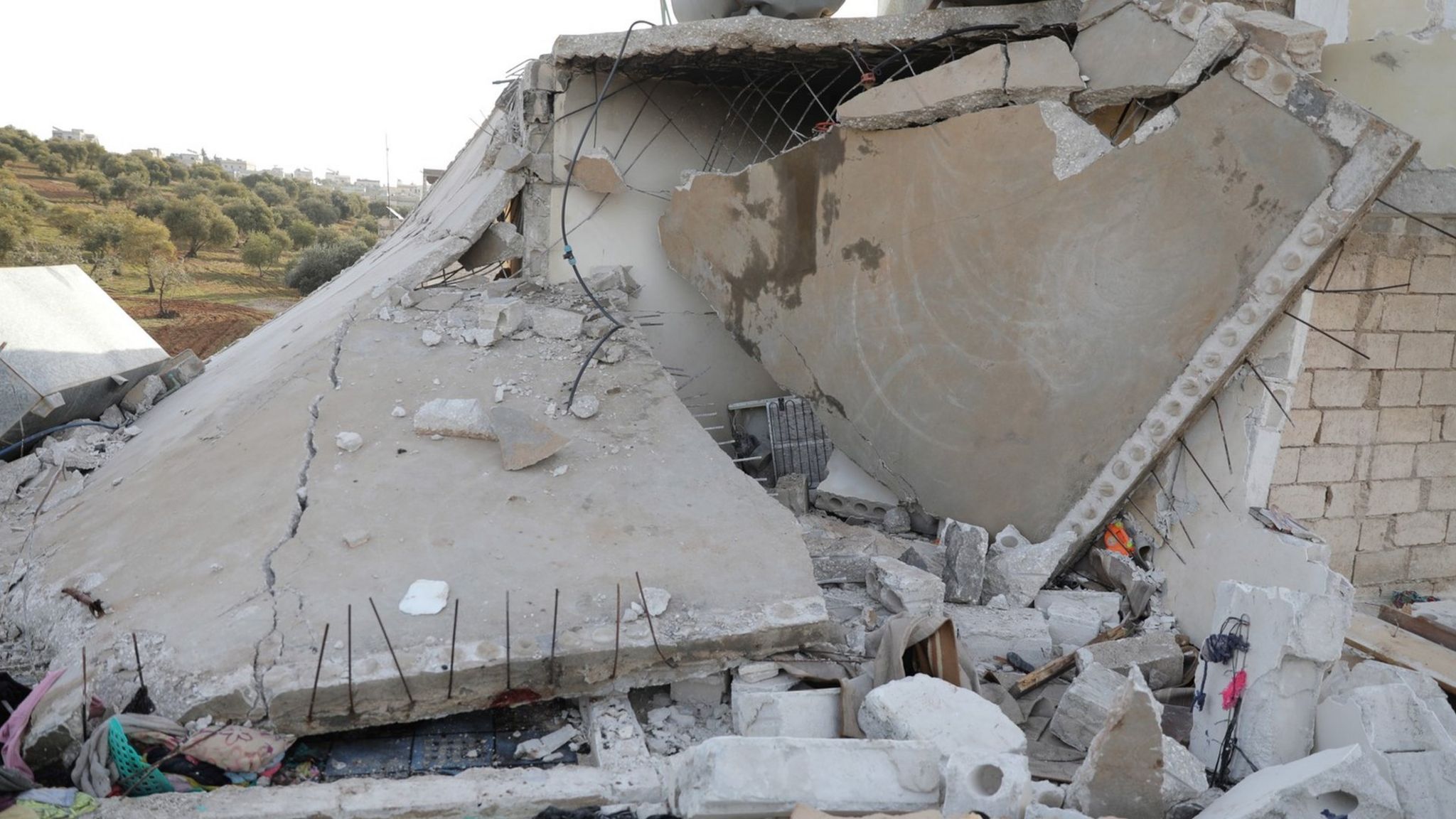 A damaged building is seen after a US special forces raid in Atmeh, Syria (3 February 2022)