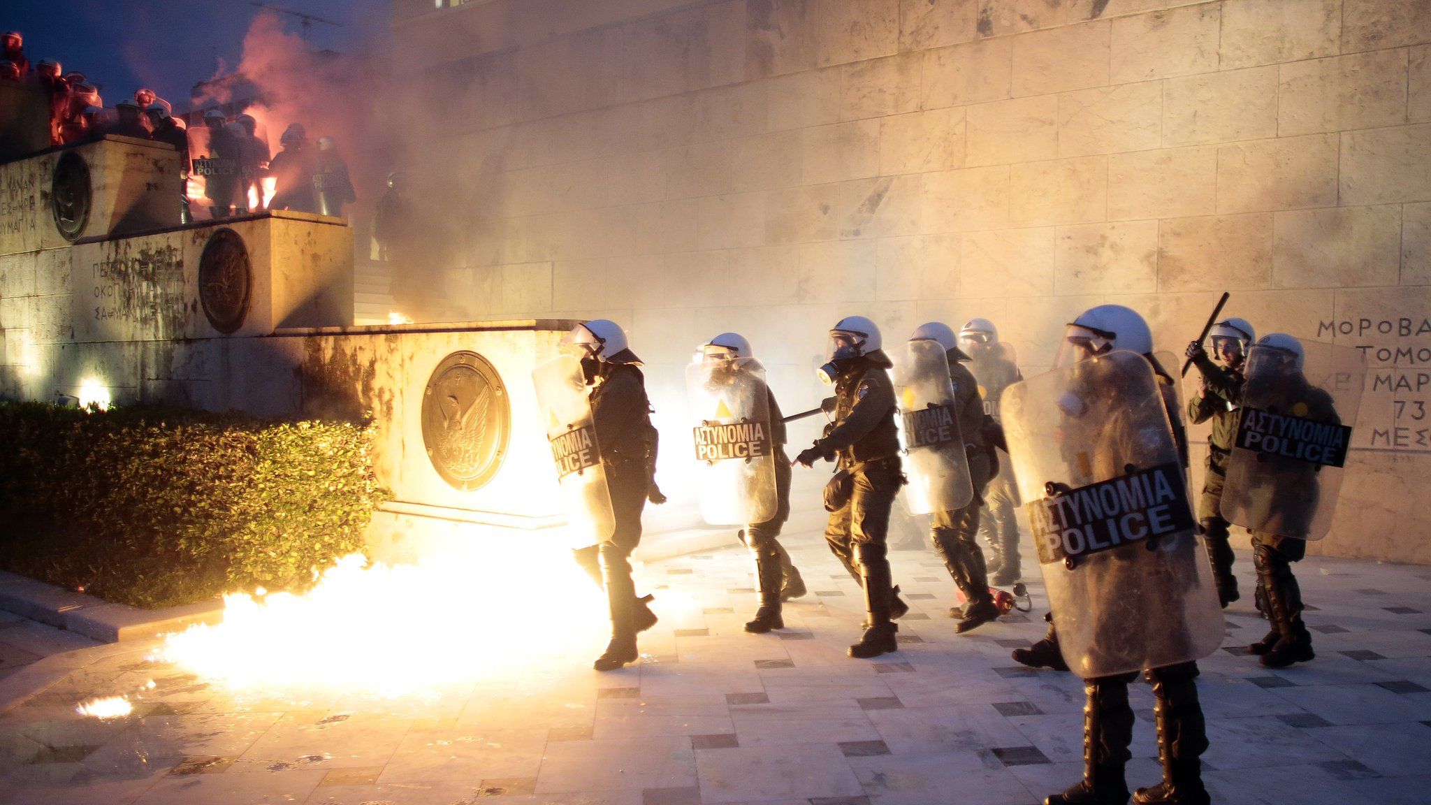 Greek police clash with protesters in front of parliament on May 18, 2017 in Athens