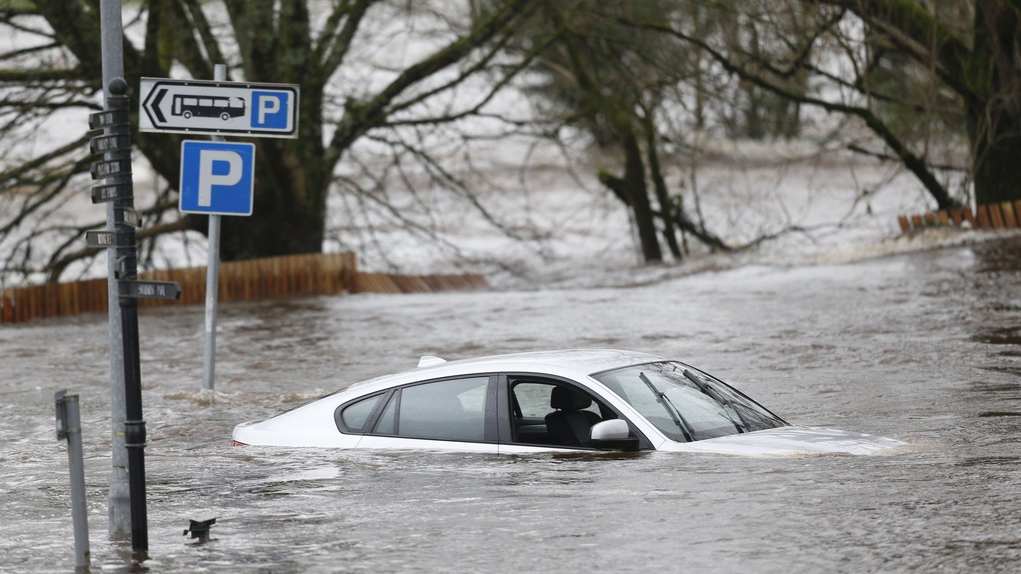 A car in flood water in Newton Stewart, Scotland