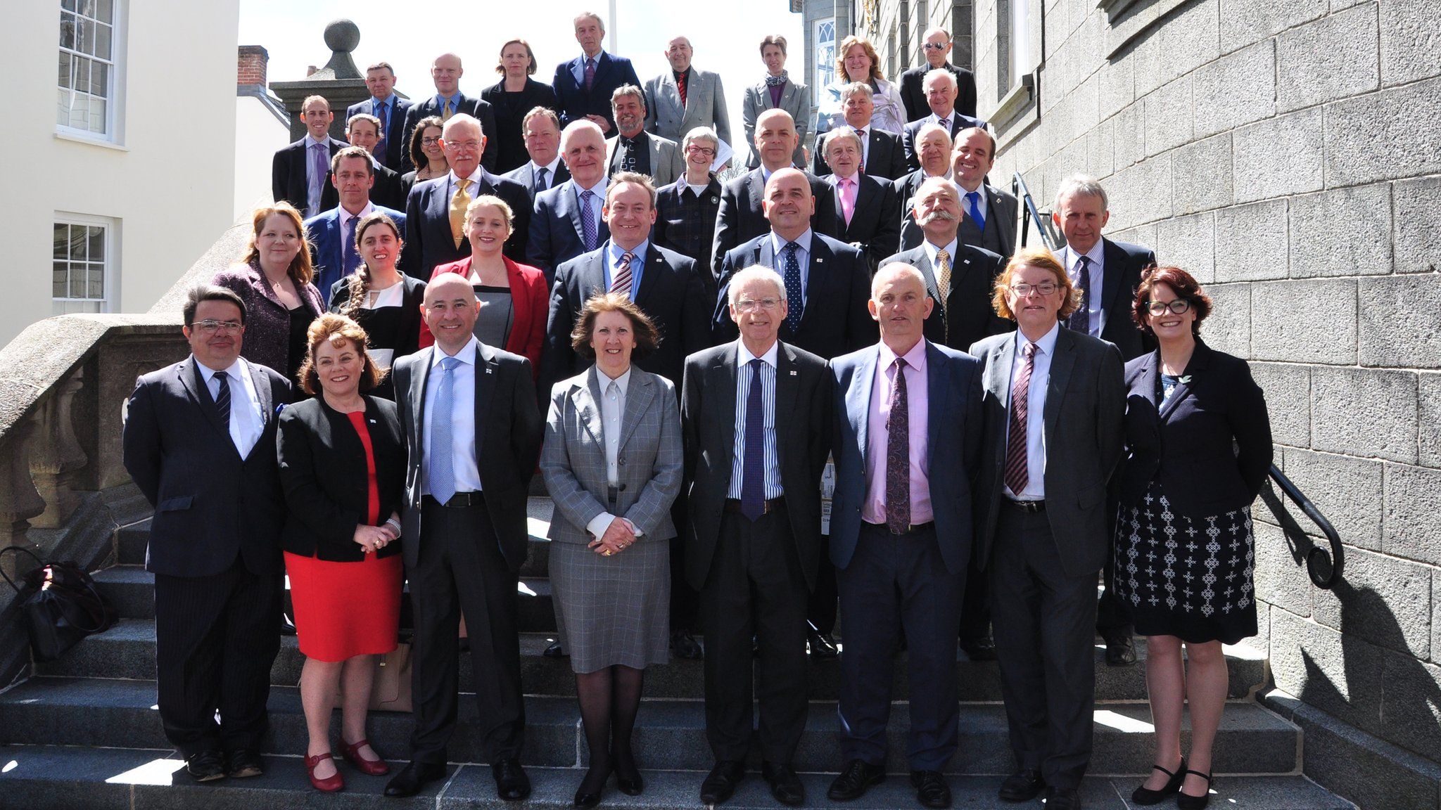 The 38 successful Guernsey election candidates on the steps of the States building