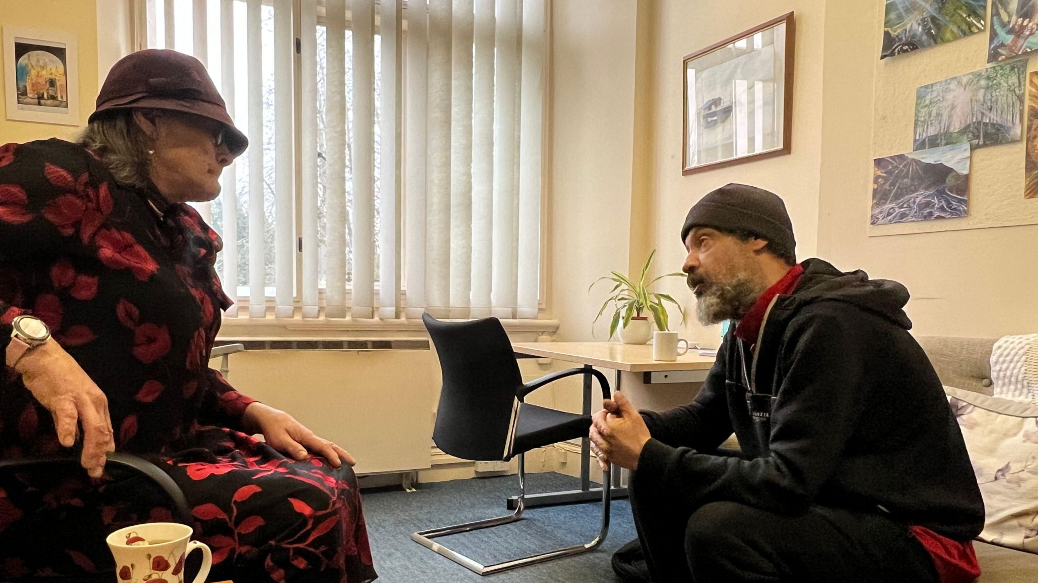 Support worker and homeless client getting support
