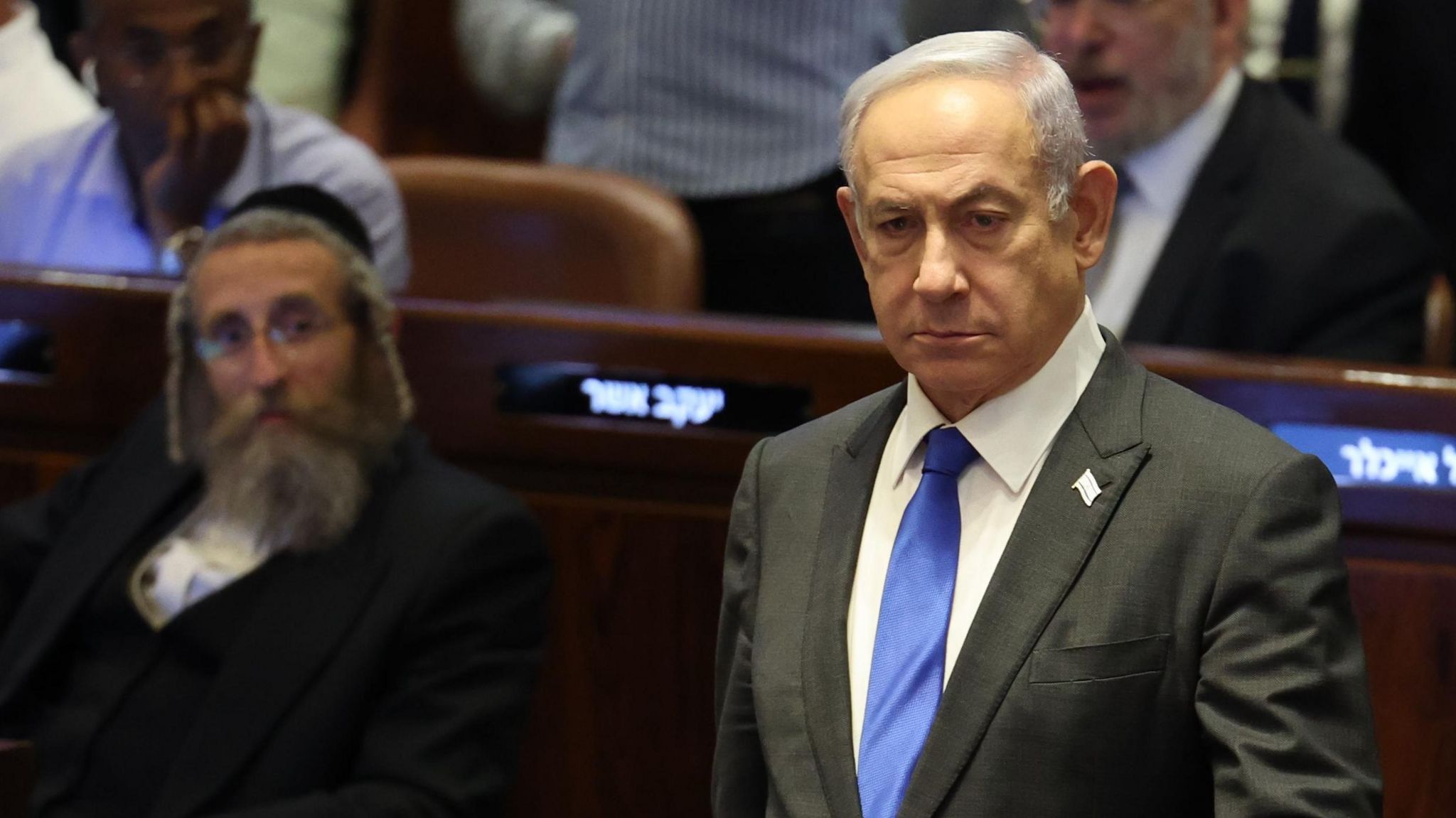 Israeli Prime Minister stands in the Knesset in Jerusalem during a vote on 19 June 2024