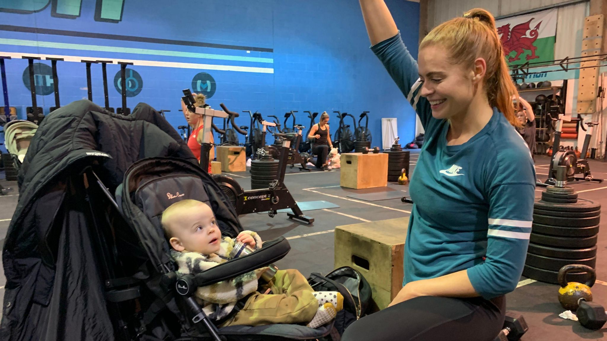 Sophie Evans exercises as baby Jack, looks on from his pram