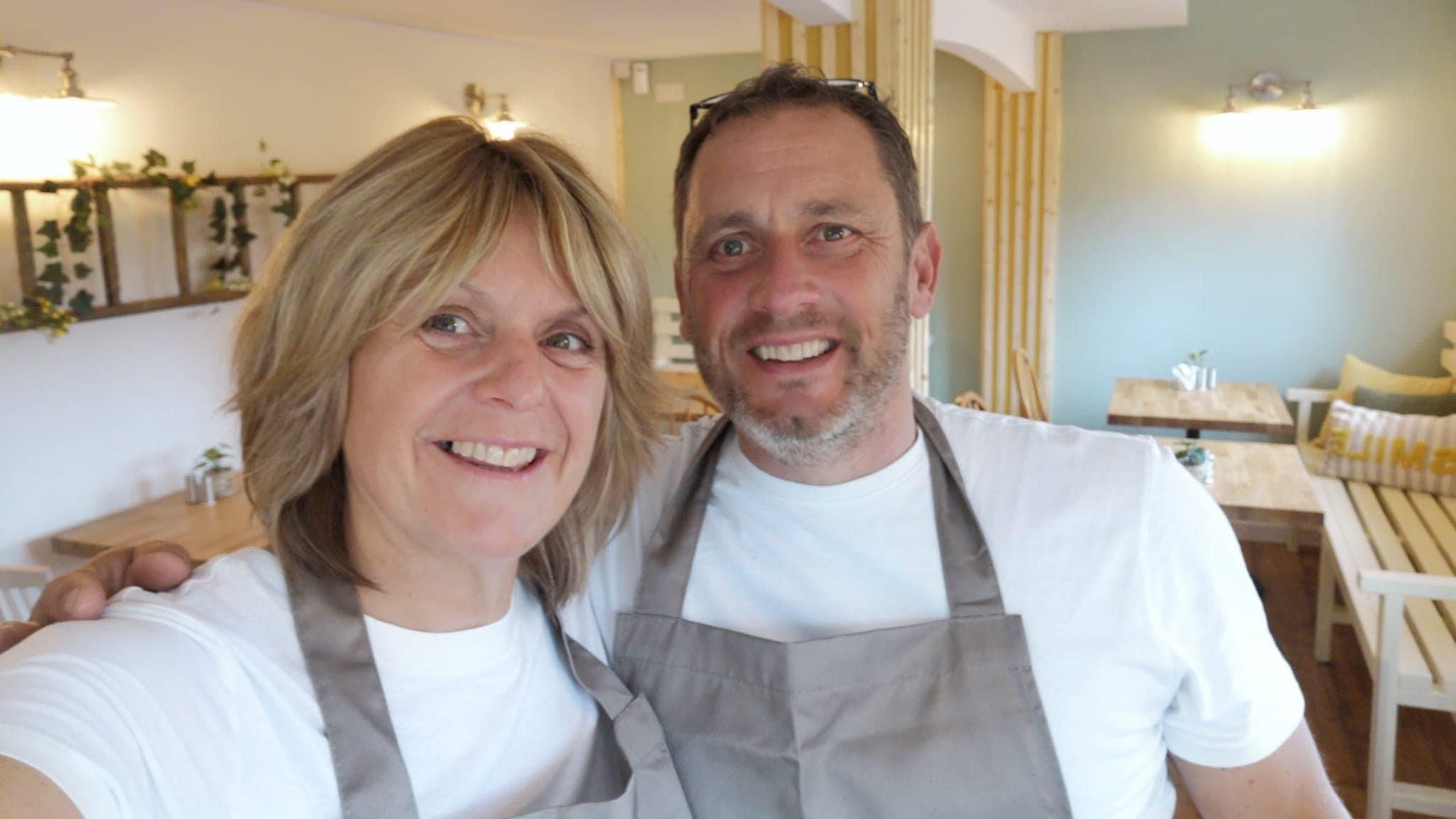 A selfie of Dawn and Andy Bailey in the cafe they run in Chaddesden Park