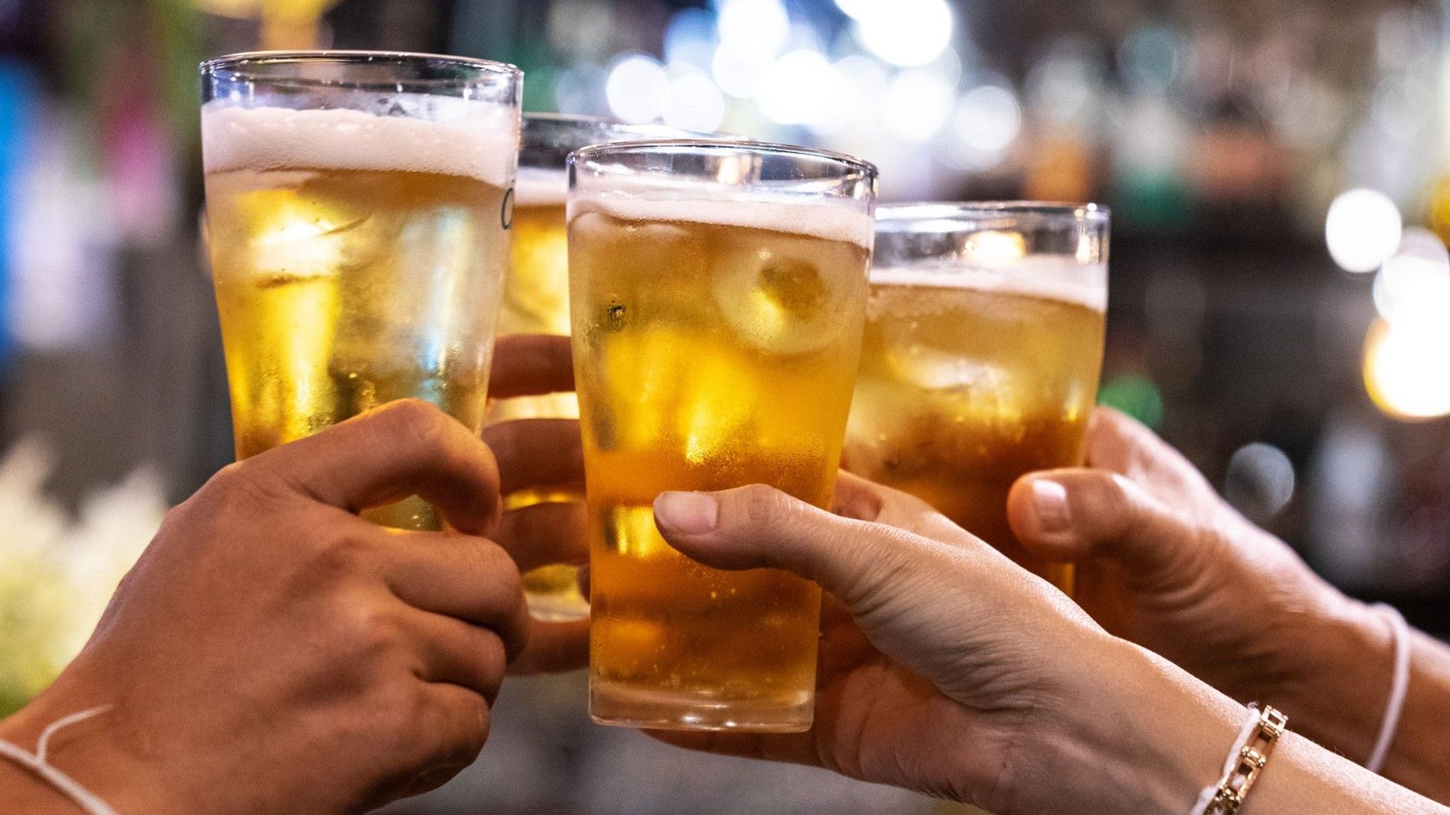 People toasting their pints of beer