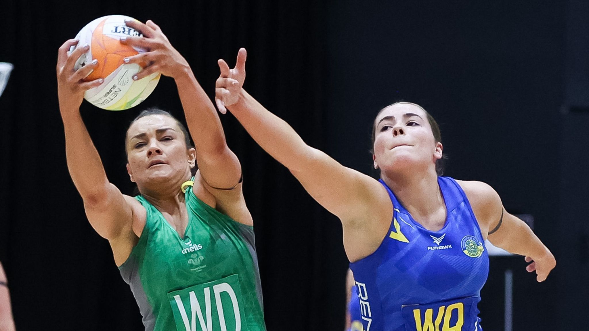 Nia Jones of Cardiff Dragons and Kirsty Harris of Team Bath competing for the ball