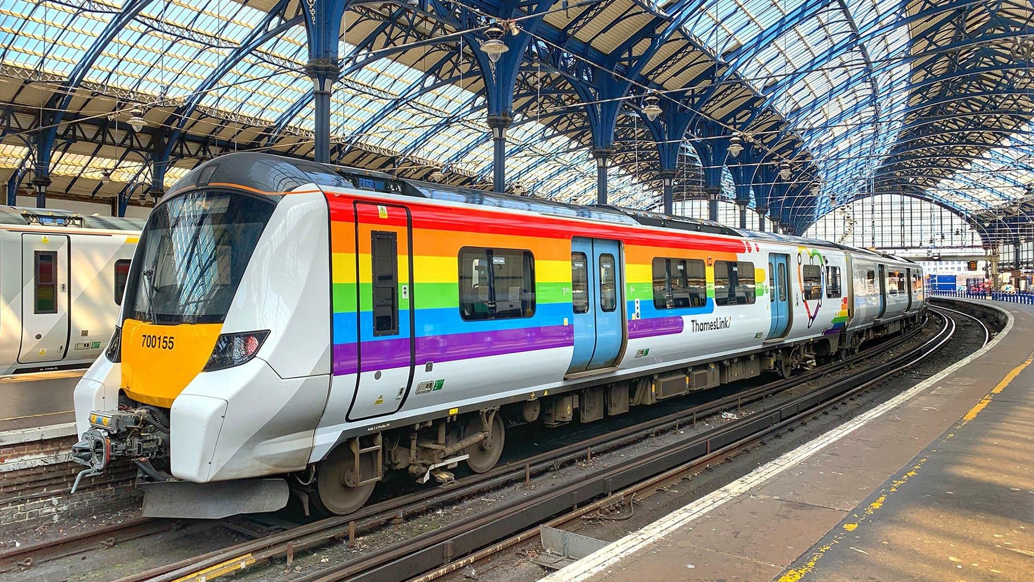 A Thameslink service at Brighton station with a rainbow livery