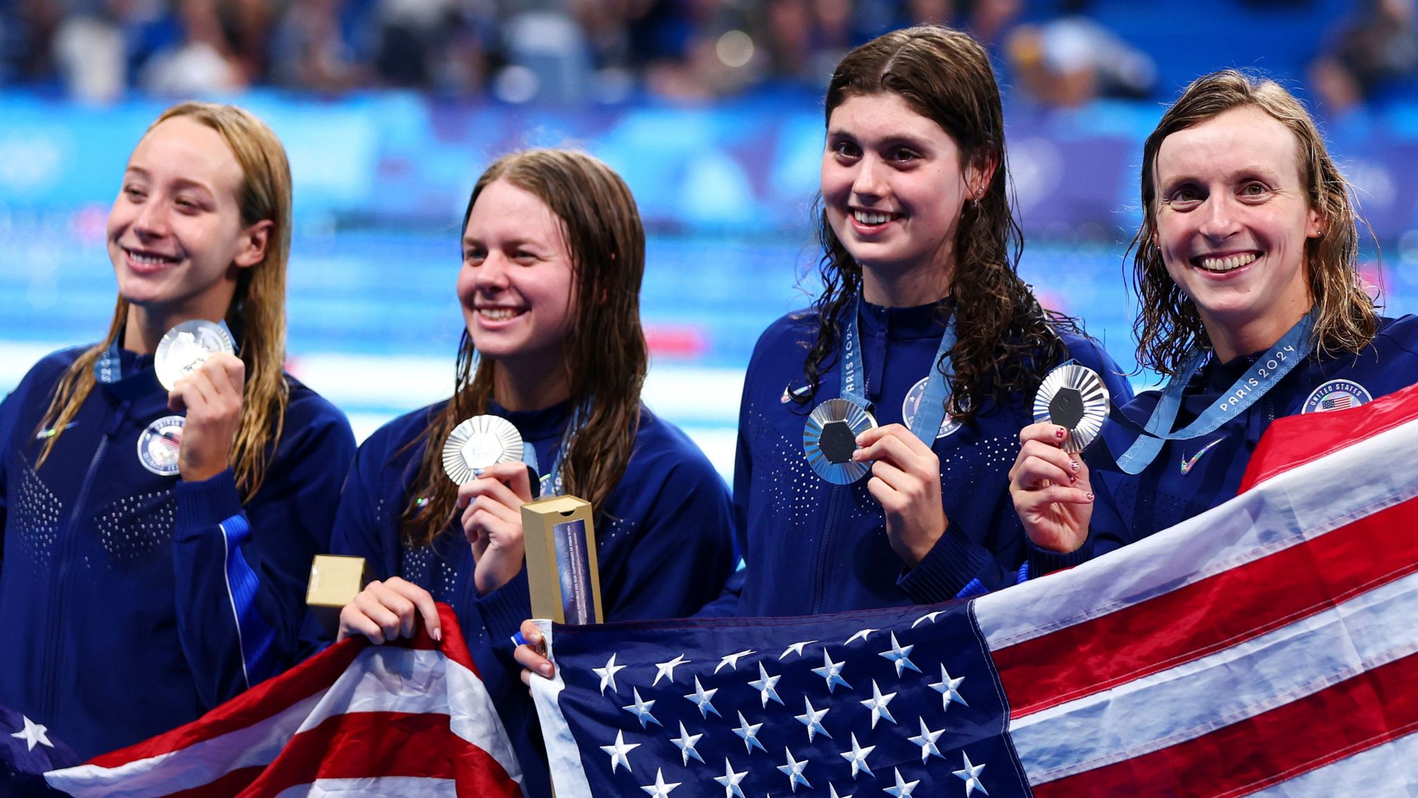 Paige Madden, Erin Gemmell, Claire Weinstein and Katie Ledecky celebrate silver