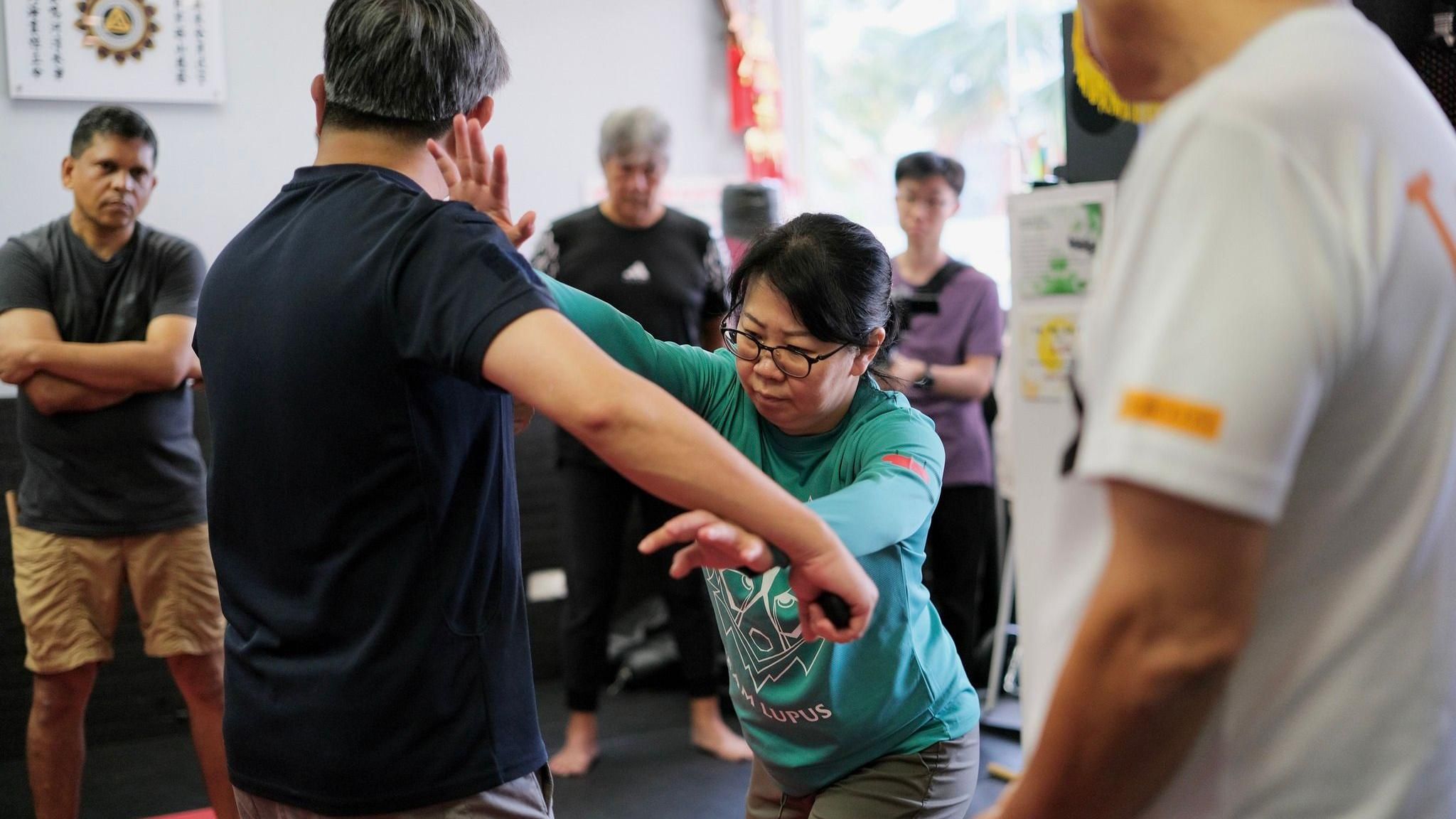 Security and safety volunteers get basic defence training to prepare for Pope Francis' visit to Singapore.