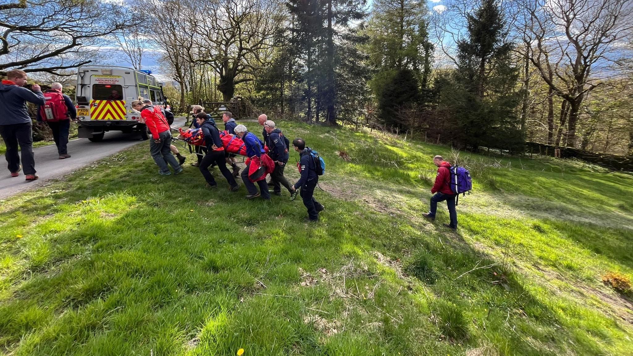 Mountain Rescue teams carrying a casualty to safety