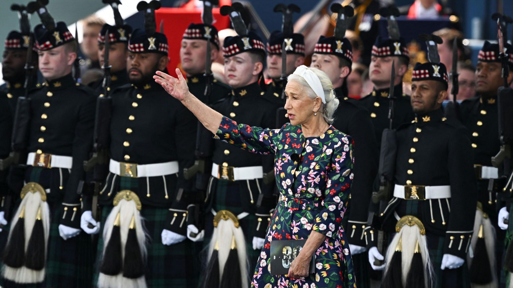 Dame Helen Mirren hosting the event at Southsea Portsmouth, stood on stage in front of soldiers