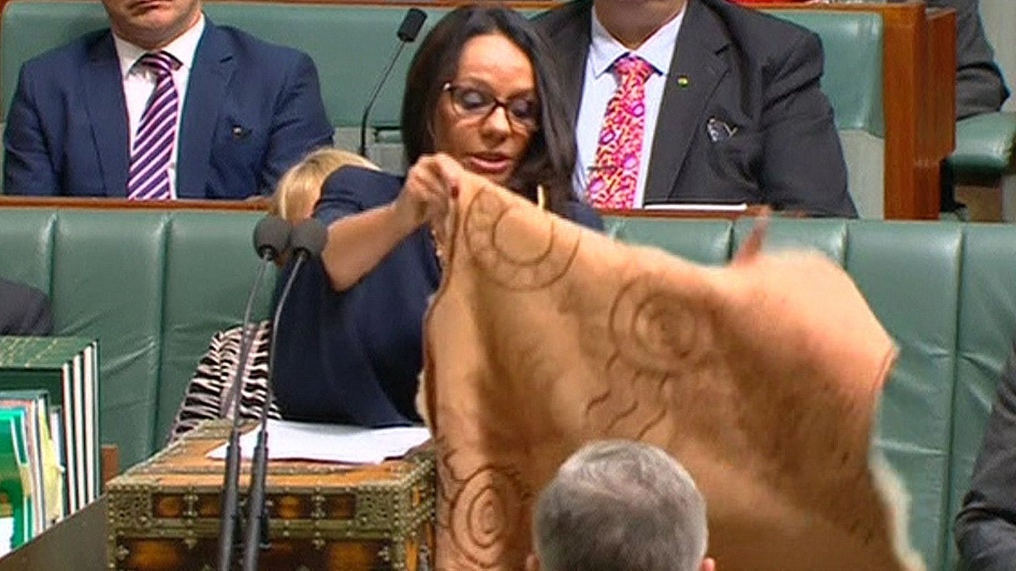 Linda Burney displays her traditional kangaroo-skin cloak at the House of Representatives in Canberra