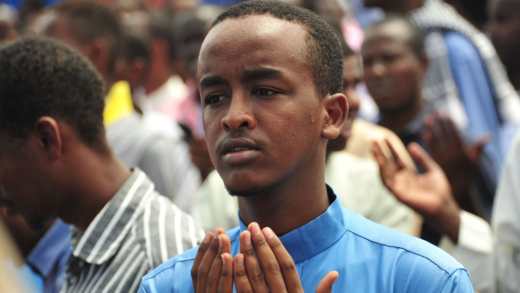 Somali man prays