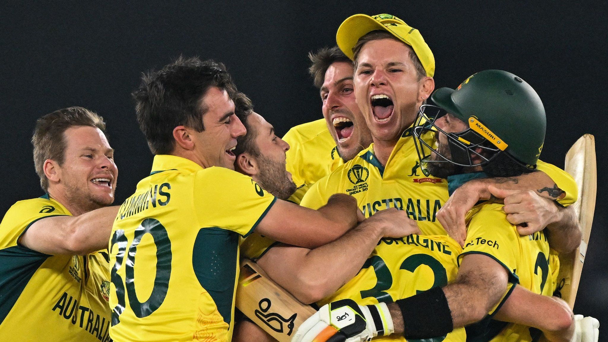 Australia plays celebrate victory over India in the 2023 Cricket World Cup final in Ahmedabad
