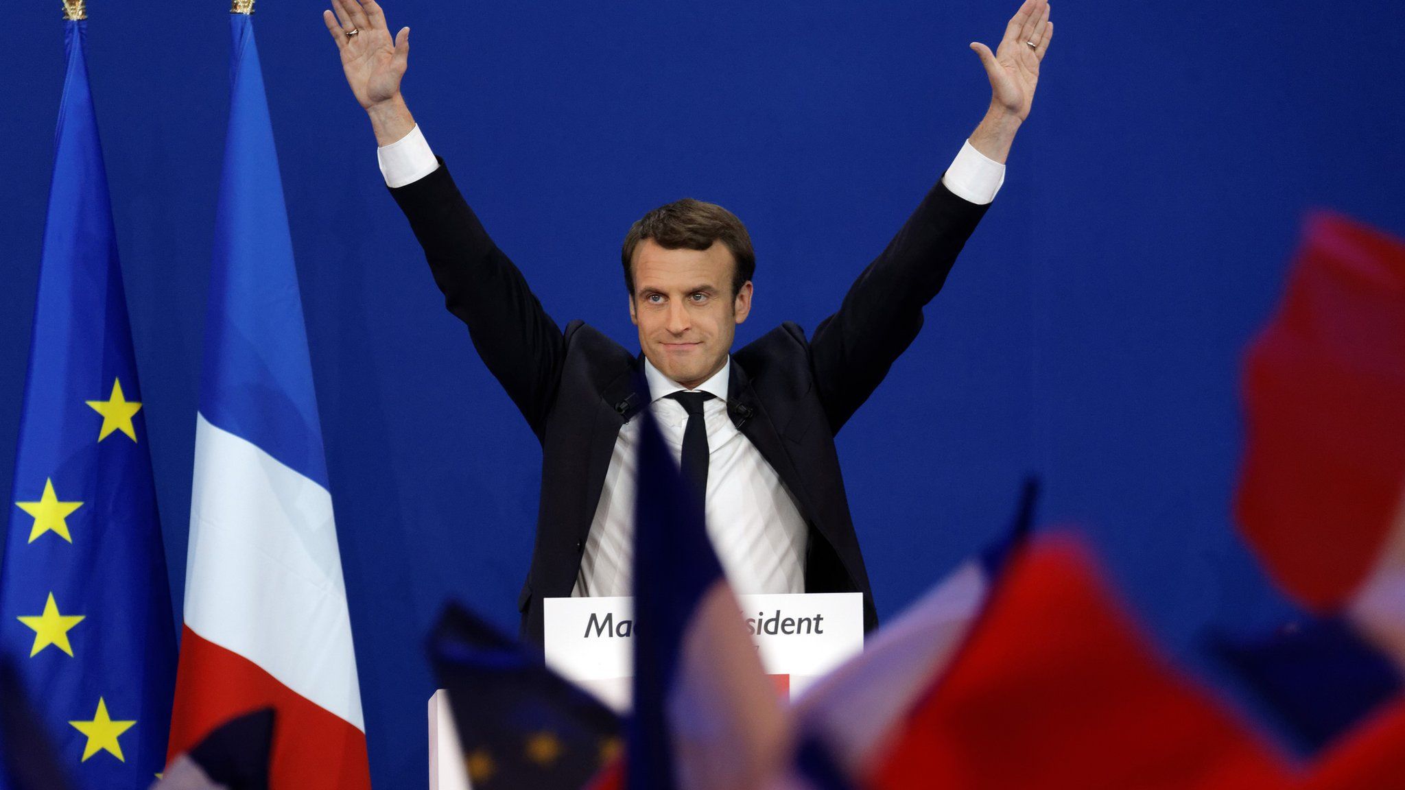 Emmanuel Macron addresses supporters at a rally