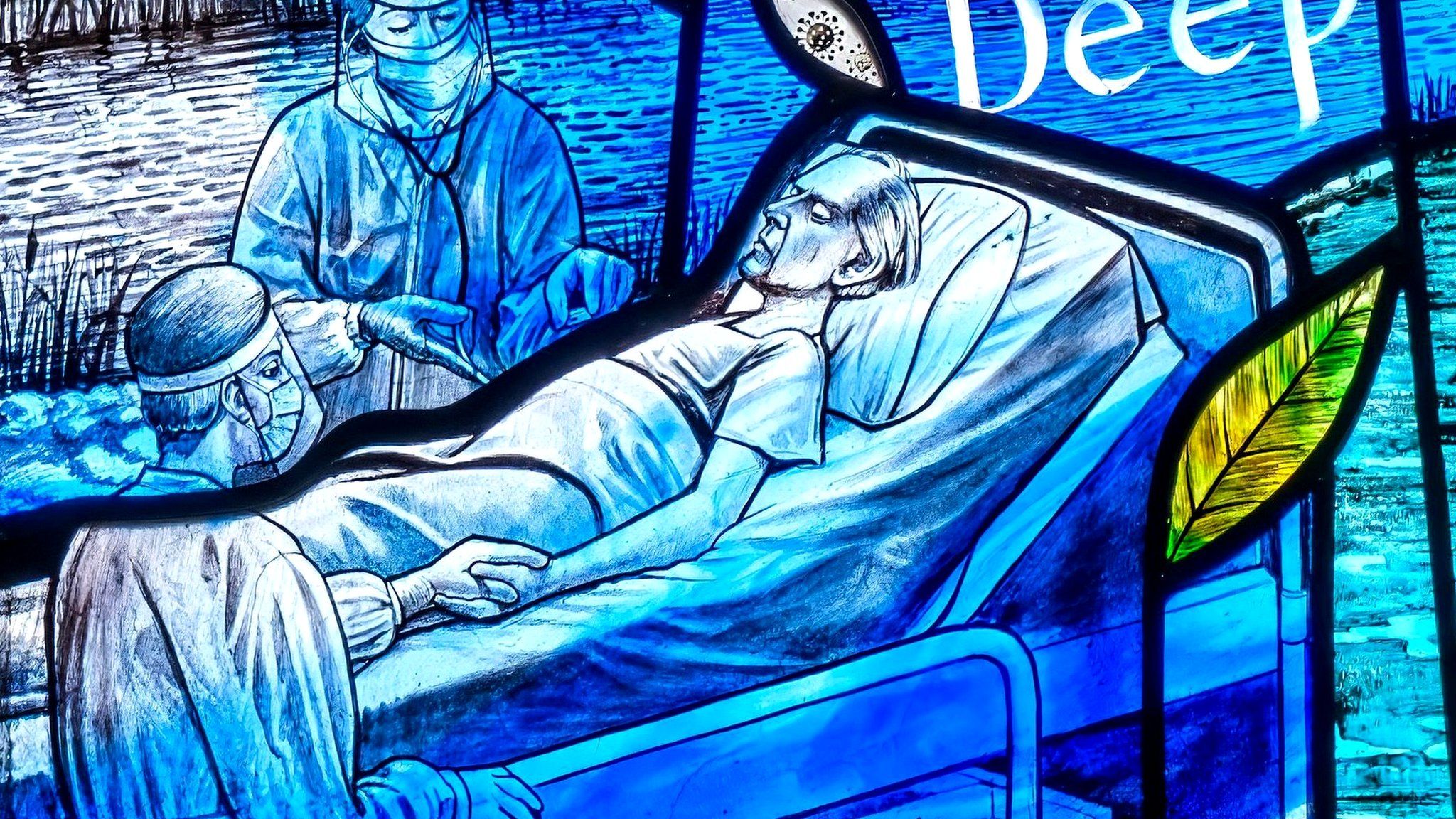 A scene from the stained glass window showing a hospital patient and doctors in PPE.