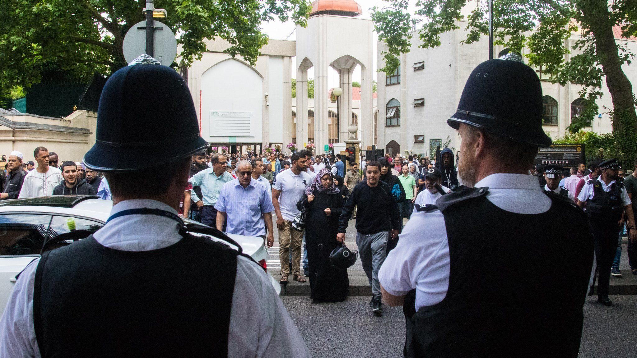Police guard Muslim worshippers as they gather for Friday prayers, following the Finsbury Park attack