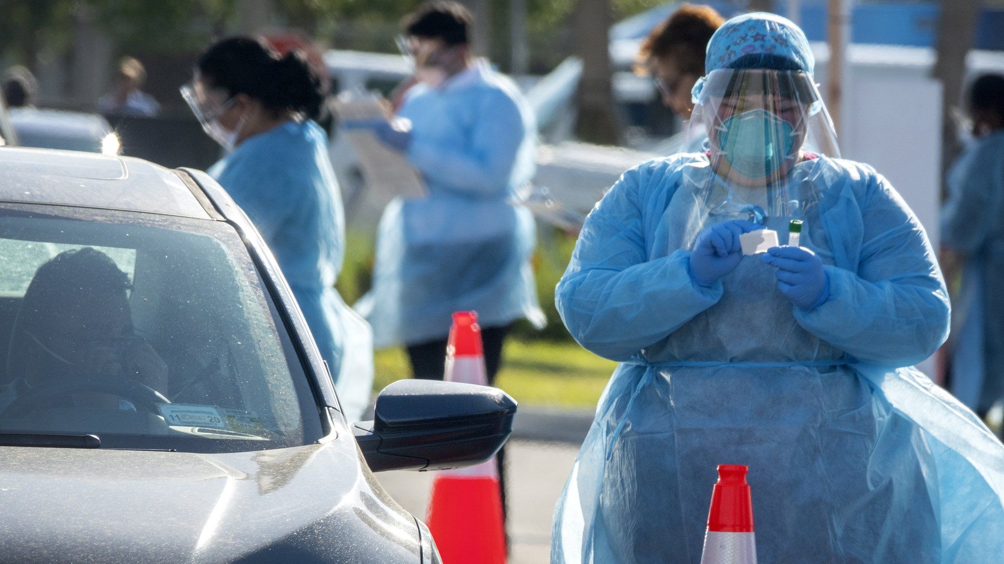 Health department employees offer roadside coronavirus testing in Miami, Florida