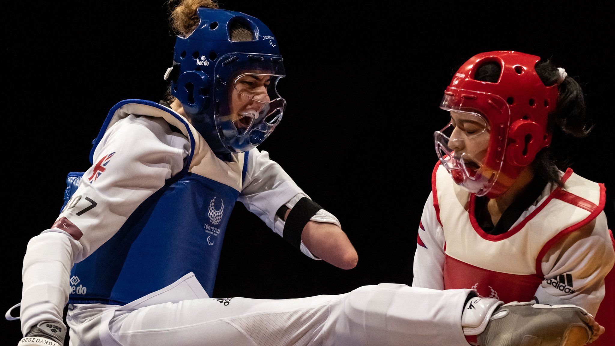 British taekwondo athlete Beth Munro challenges Nepal's Palesha Goverdhan at the Tokyo Paralympics