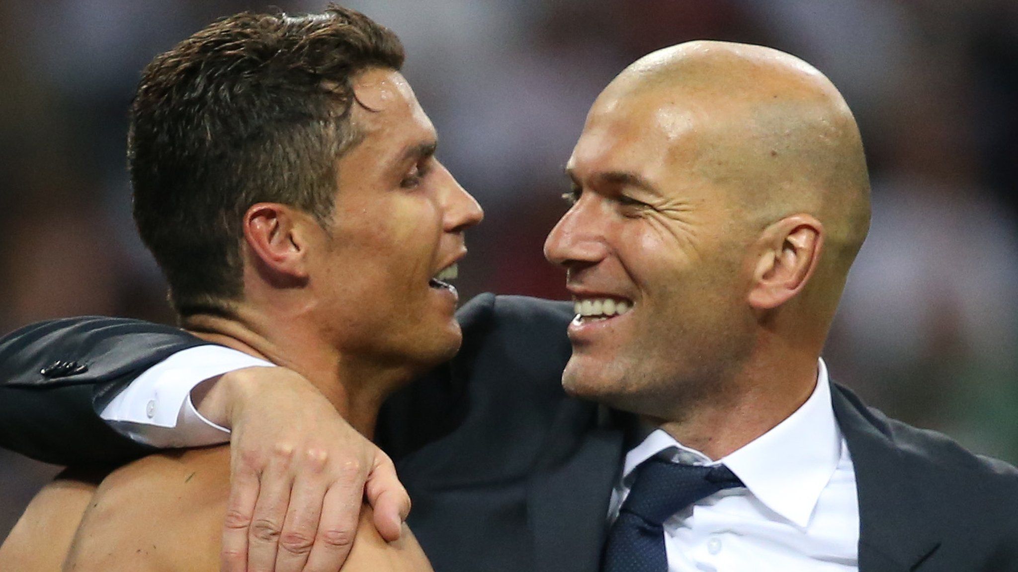 Cristiano Ronaldo celebrates with Zinedine Zidane after Real Madrid win the 2016 Champions League