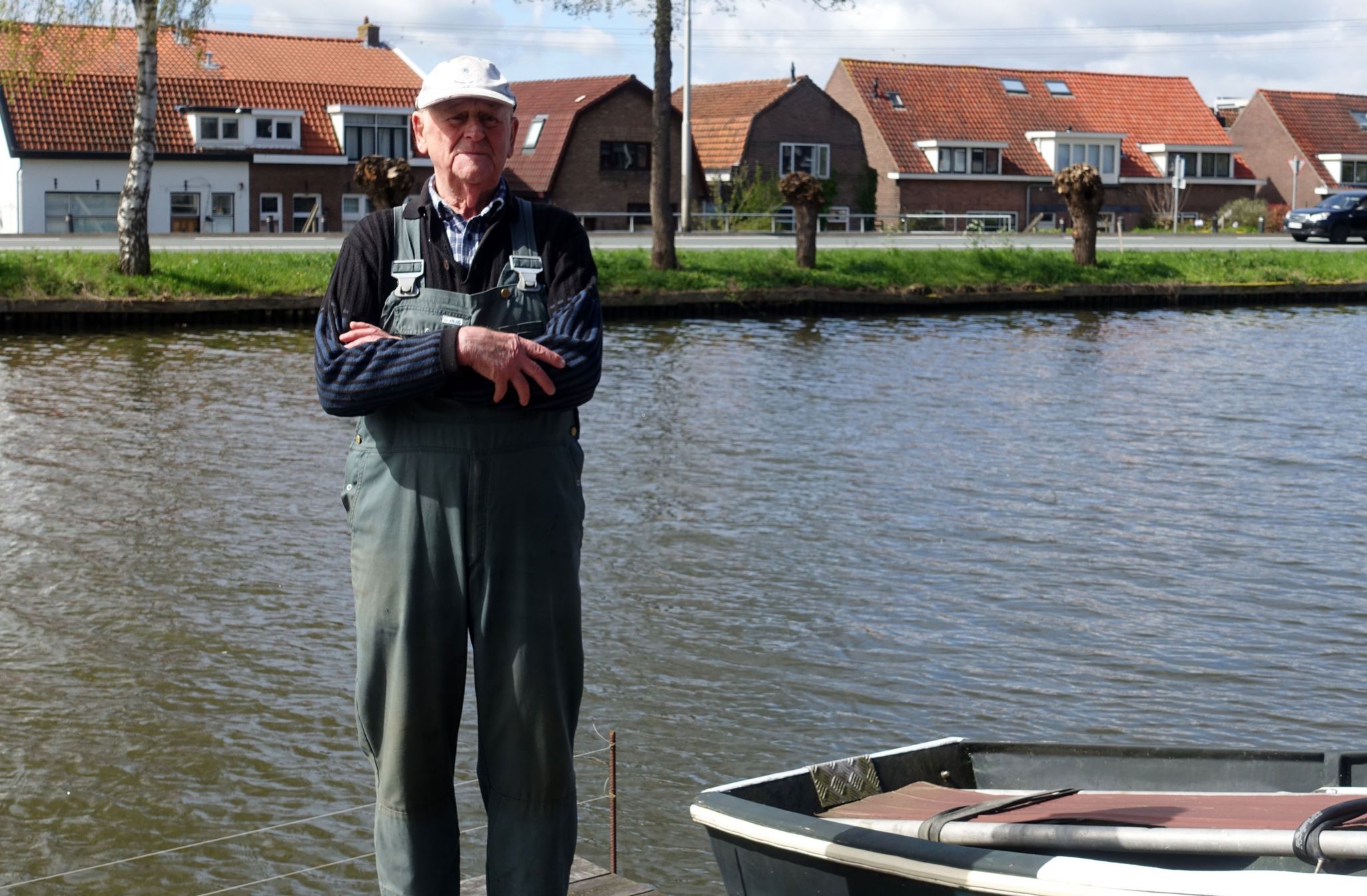 Jan Meijer standing by the river where he found the wheelie bin.