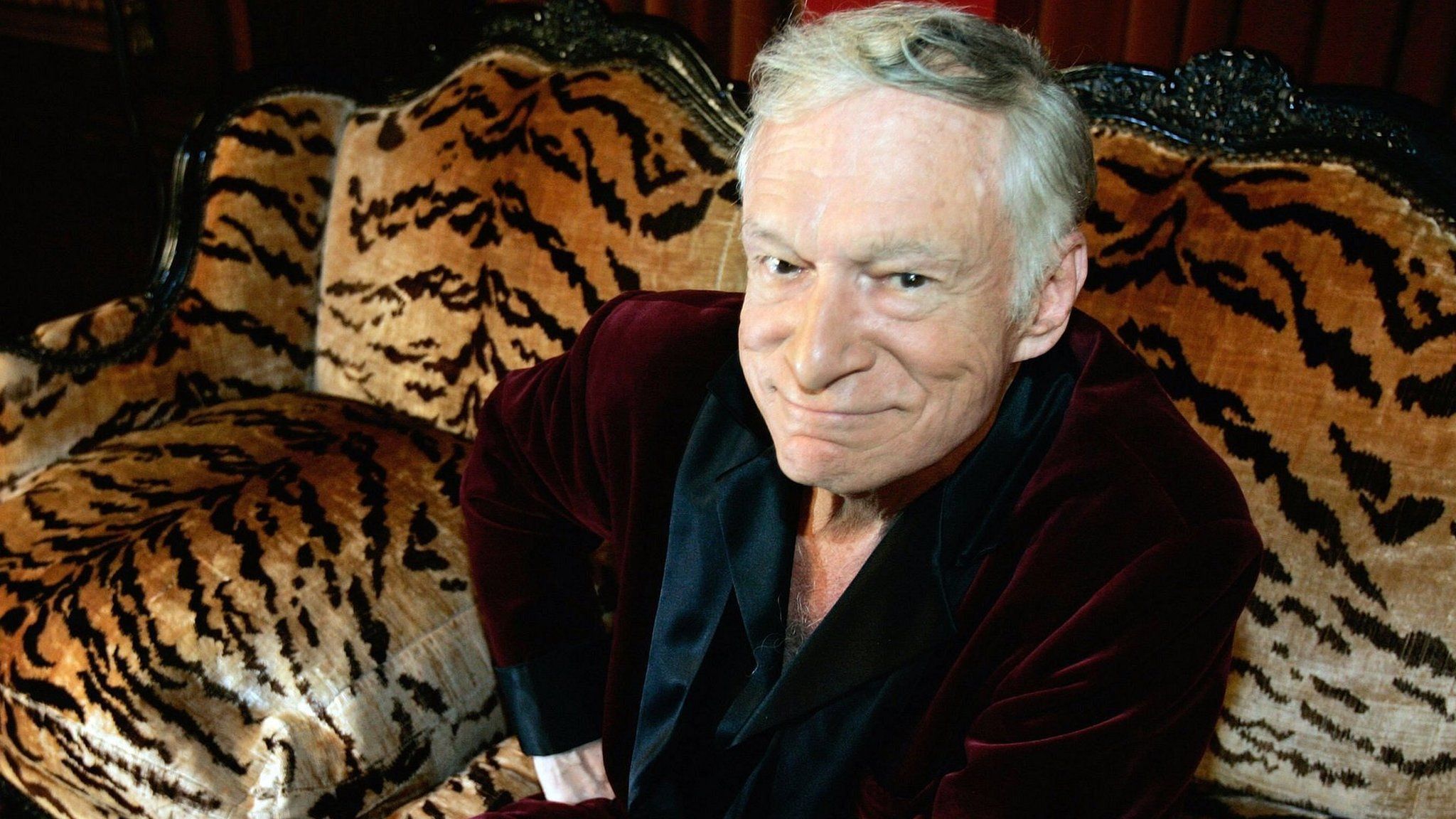 This file photo taken on August 23, 2006 shows Hugh Hefner, CEO of Playboy Enterprises, posing for a photo during an interview with journalists at his mansion in Los Angeles, California