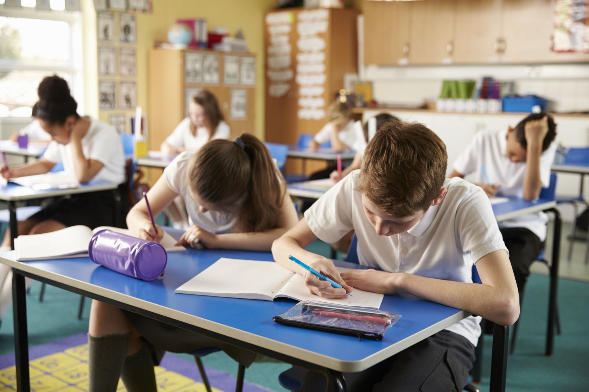 A school classroom where children are studying