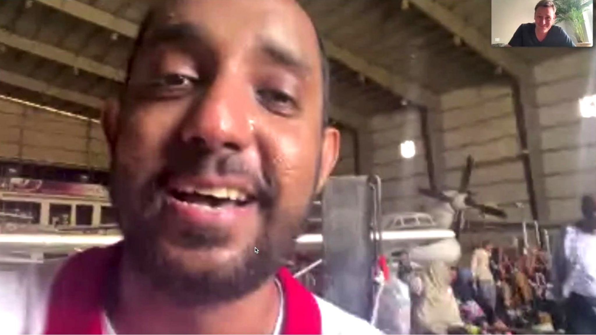 Dr Abdulrahman Babiker in the departure area of an evacuation airport near Khartoum