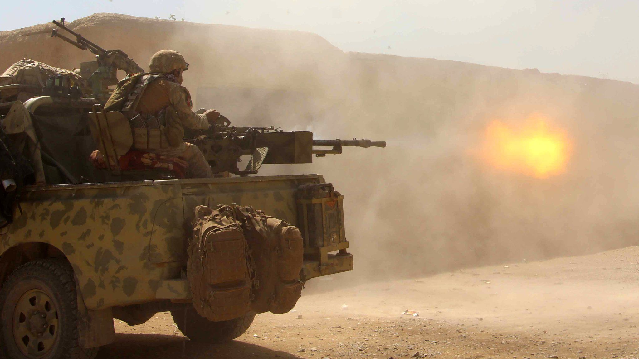 The Afghan National Army opens fire on a Taliban position during a military operation in Helmand province, 9 October 2016