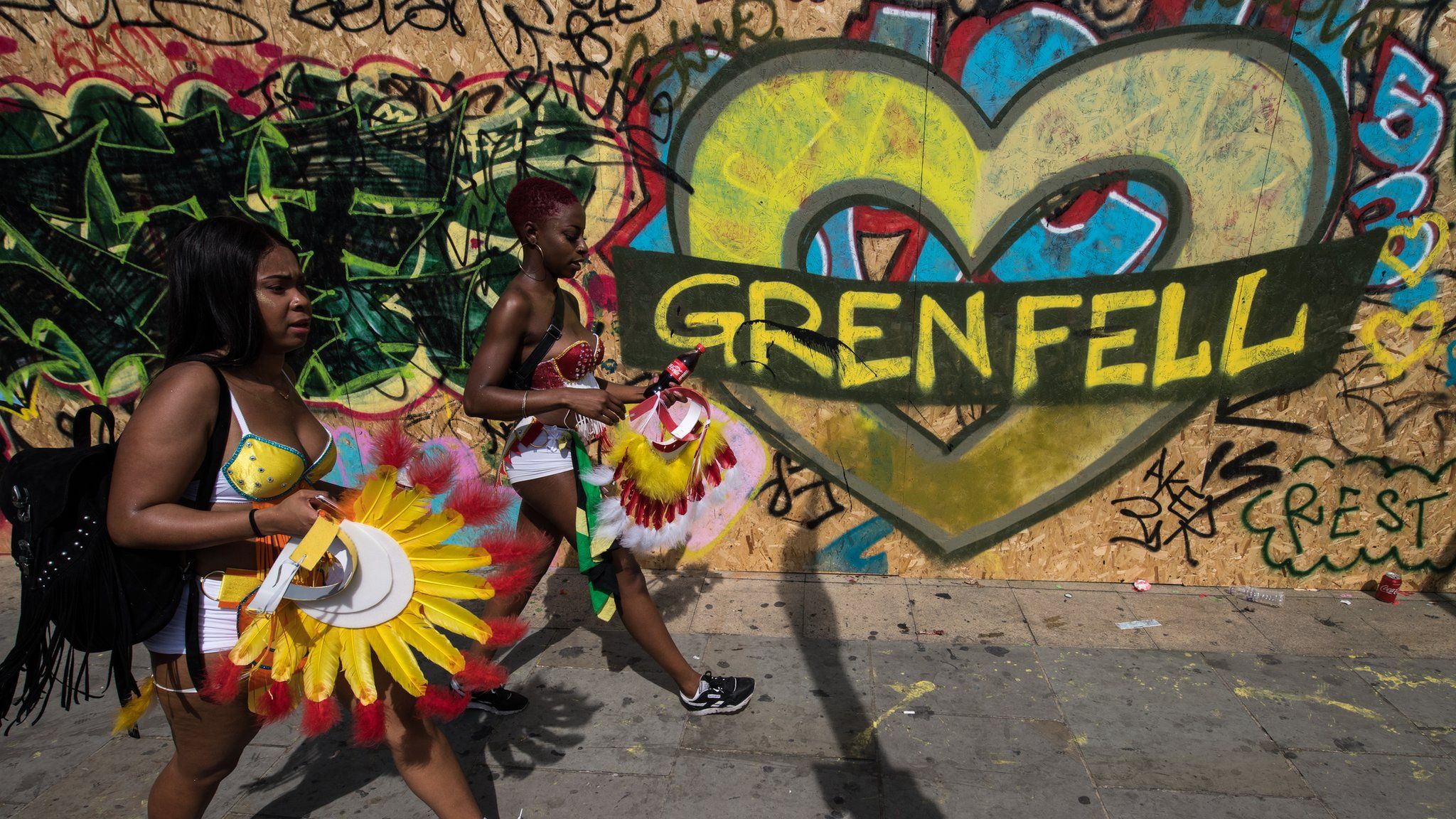 Notting Hill carnival heart shaped mural reading Grenfell