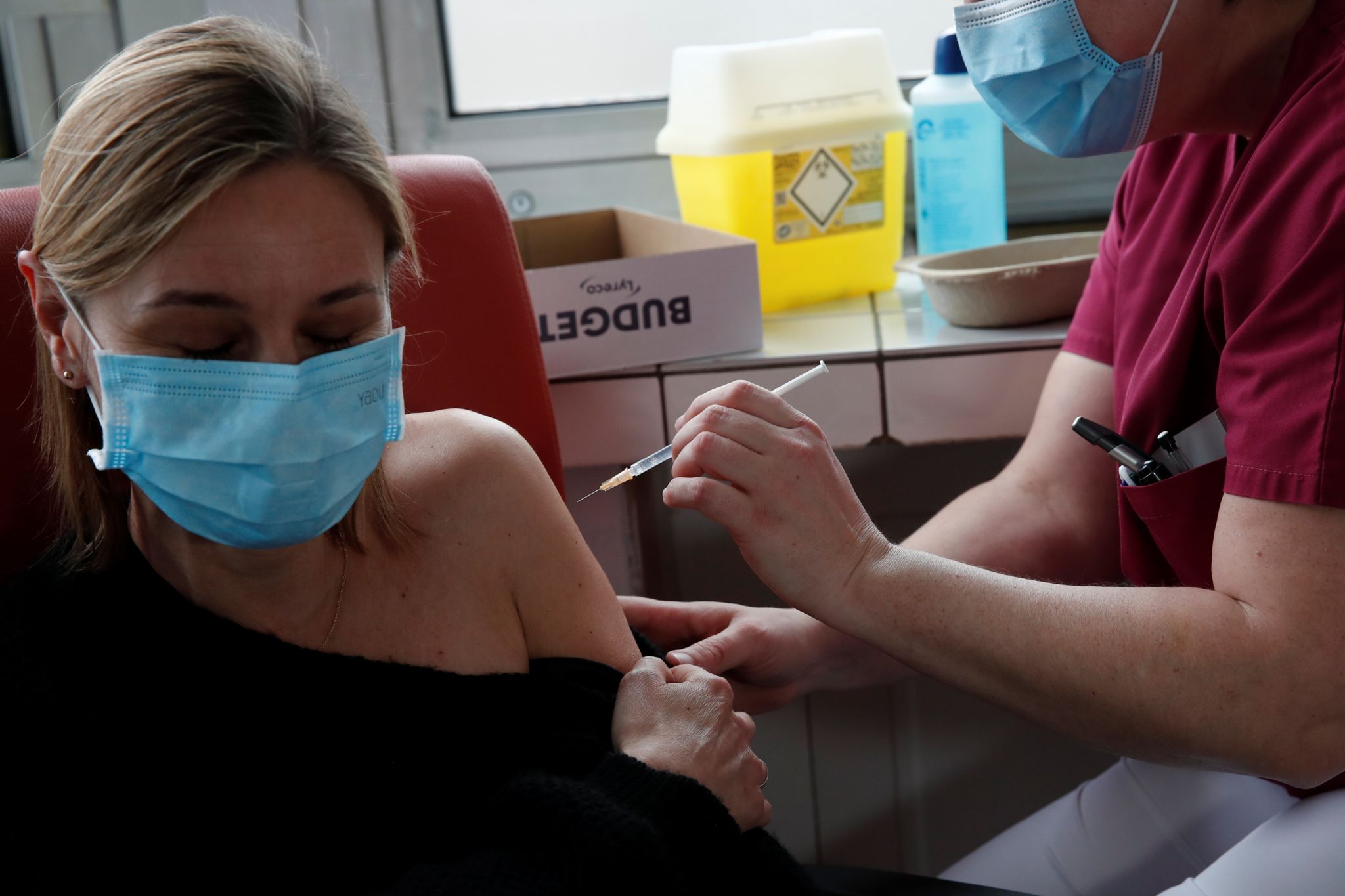 A woman is vaccinated against Covid-19 in Paris, France
