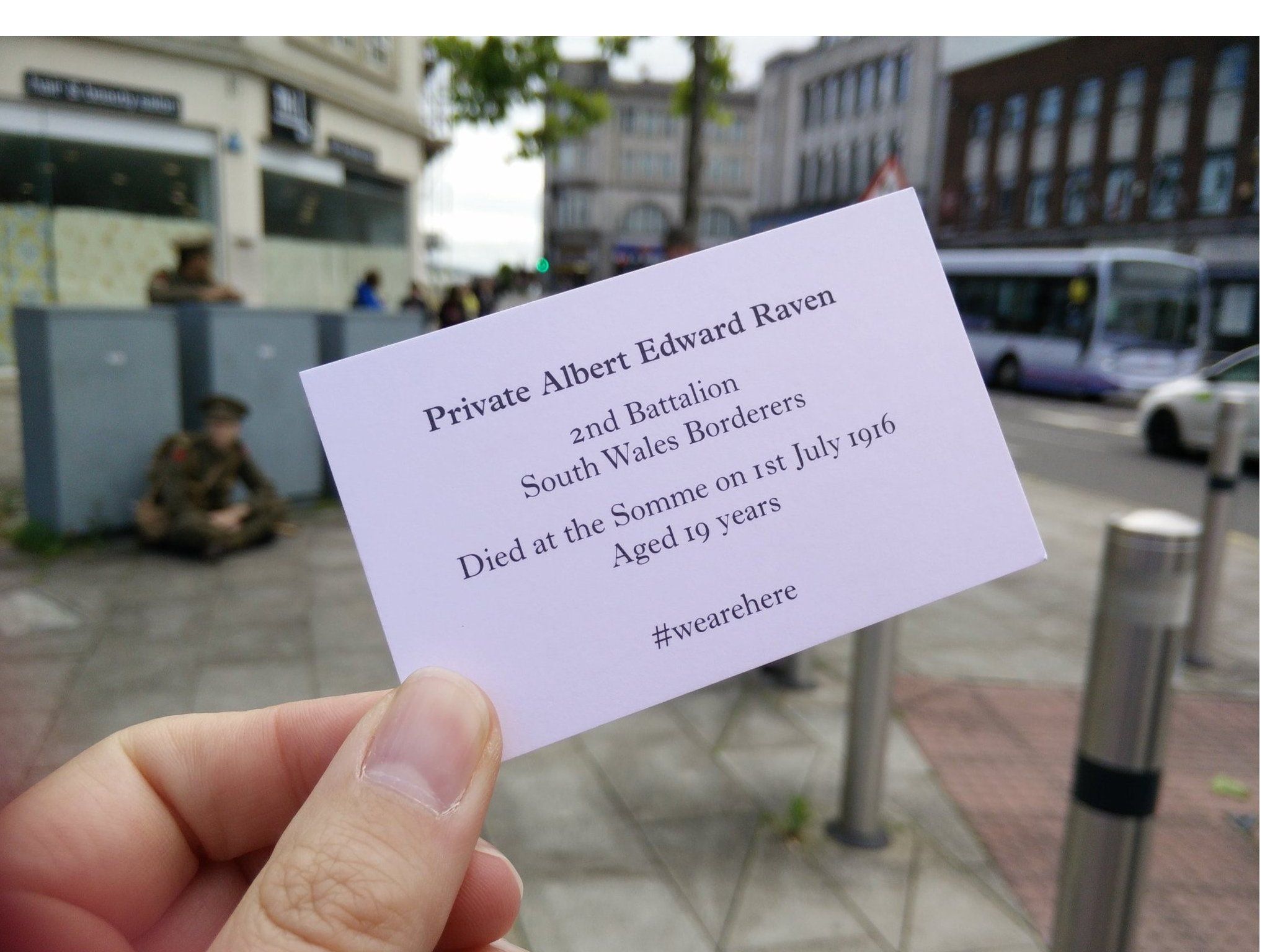 Soldiers in Swansea hand cards to the public