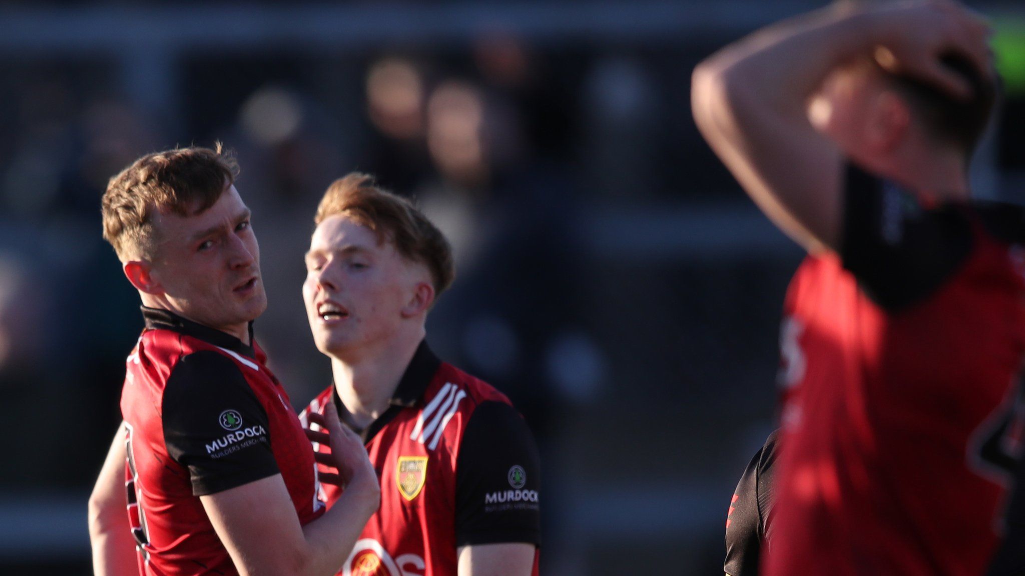 Liam Kerr, Oisin Savage and Ceilum Doherty rue a missed Down goal chance against Antrim