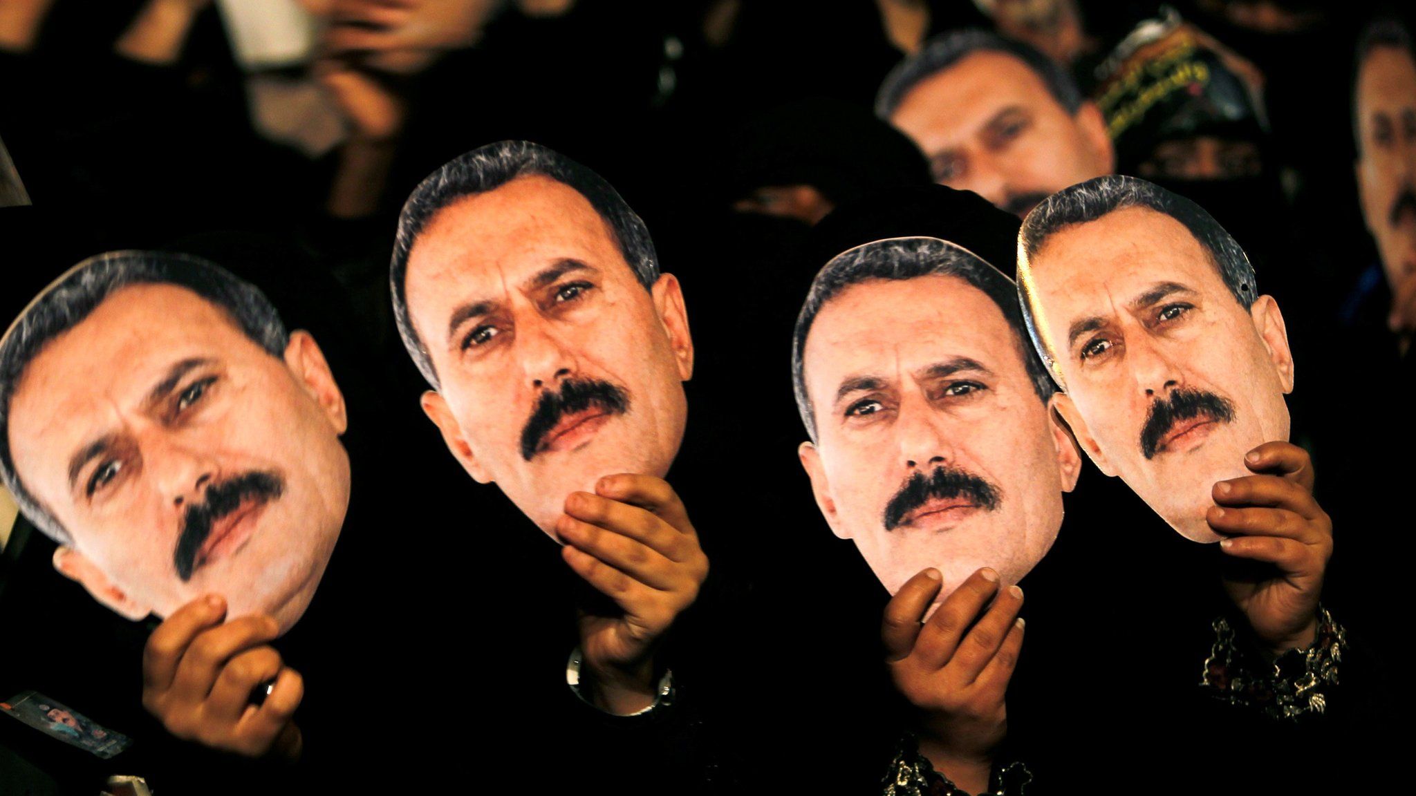 Female supporters of Ali Abdullah Saleh hold up posters during a rally marking his 70th birthday anniversary in Sanaa (23 March 2012)