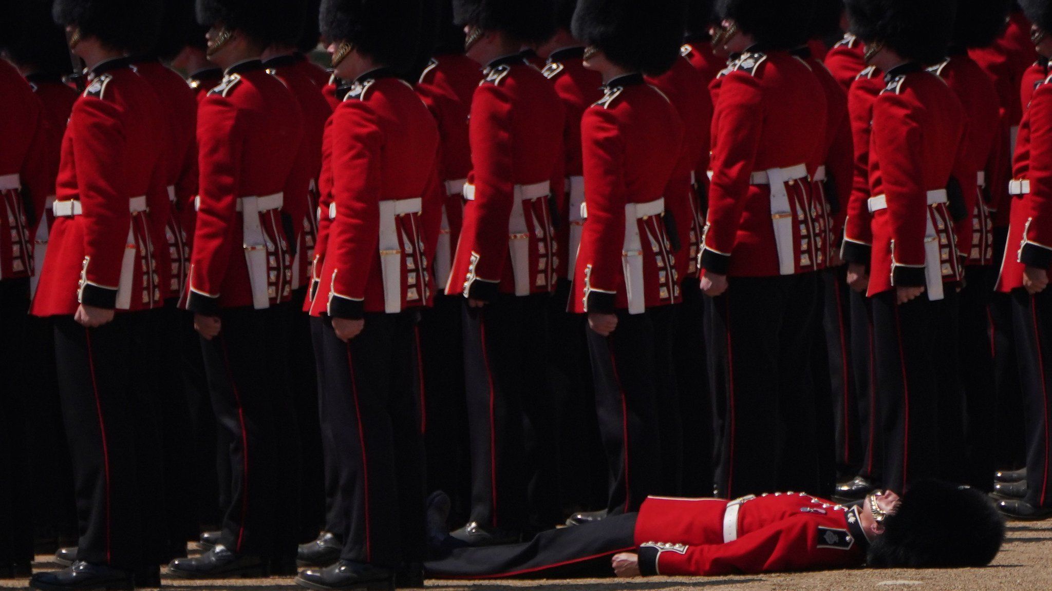 A member of the military faints during the Colonel's Review, for Trooping the Colour, at Horse Guards Parade in London, ahead of the King's Birthday Parade next Saturday