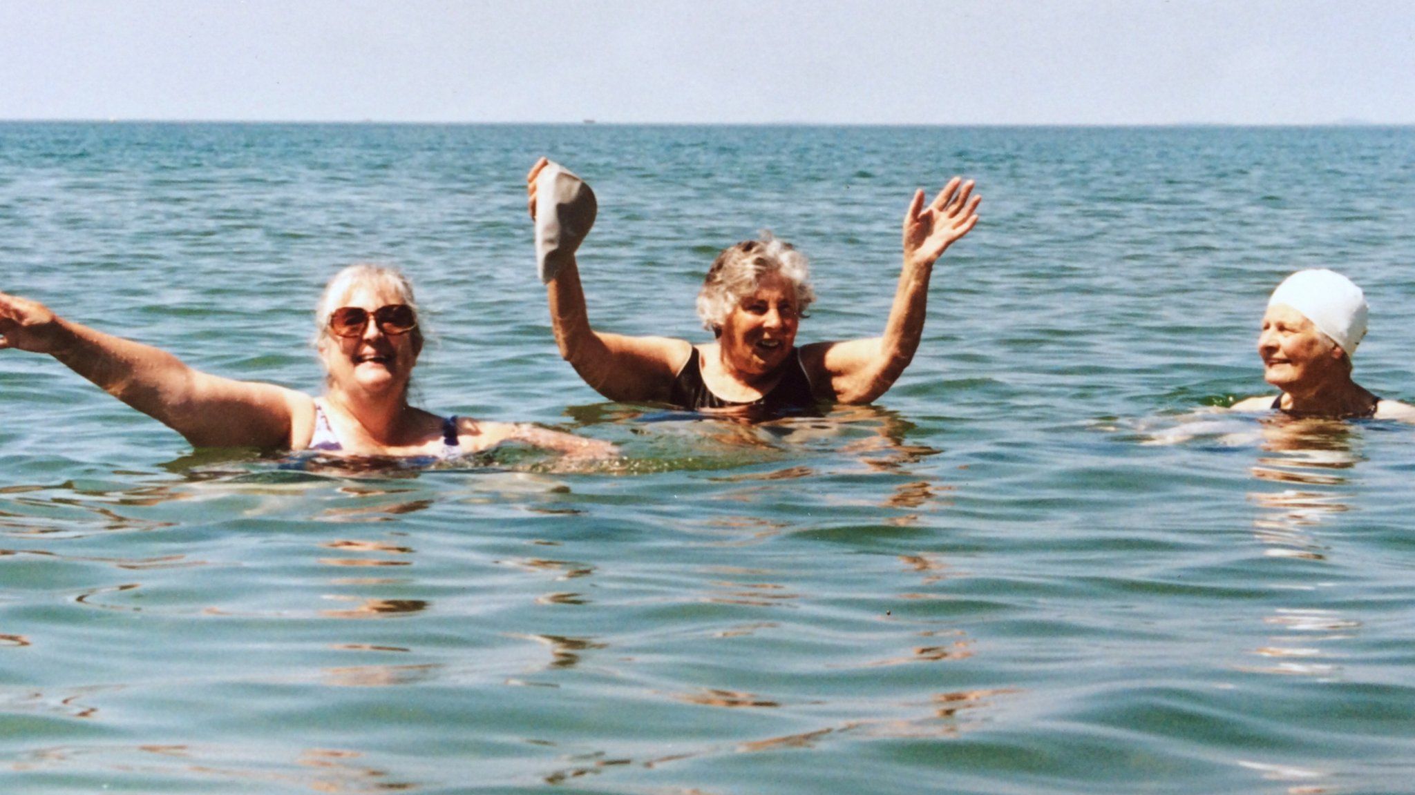 Joyce Currie in 2006 aged 81 swimming off Fairbourne beach with friends Sandra and Eileen