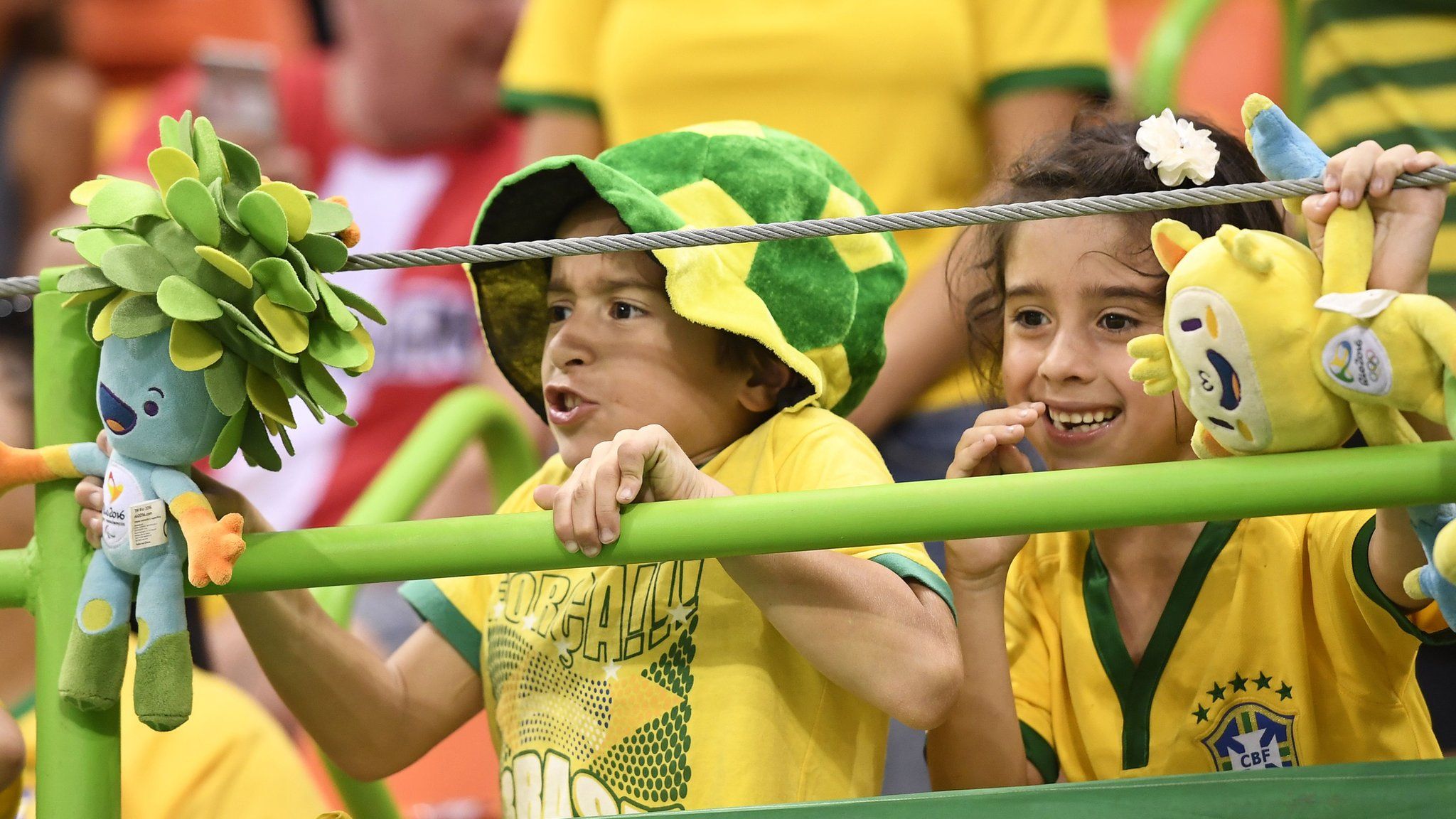 Young Brazilian fans with Paralympic and Olympic mascots