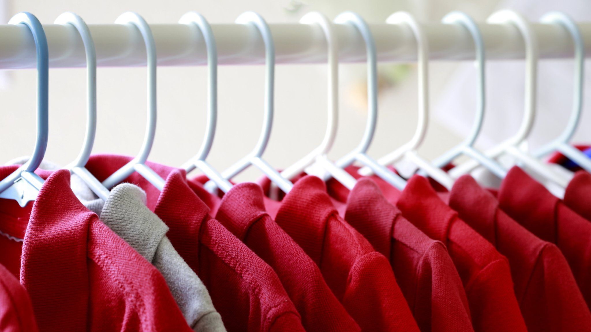 Red T-shirts hanging on a hanger
