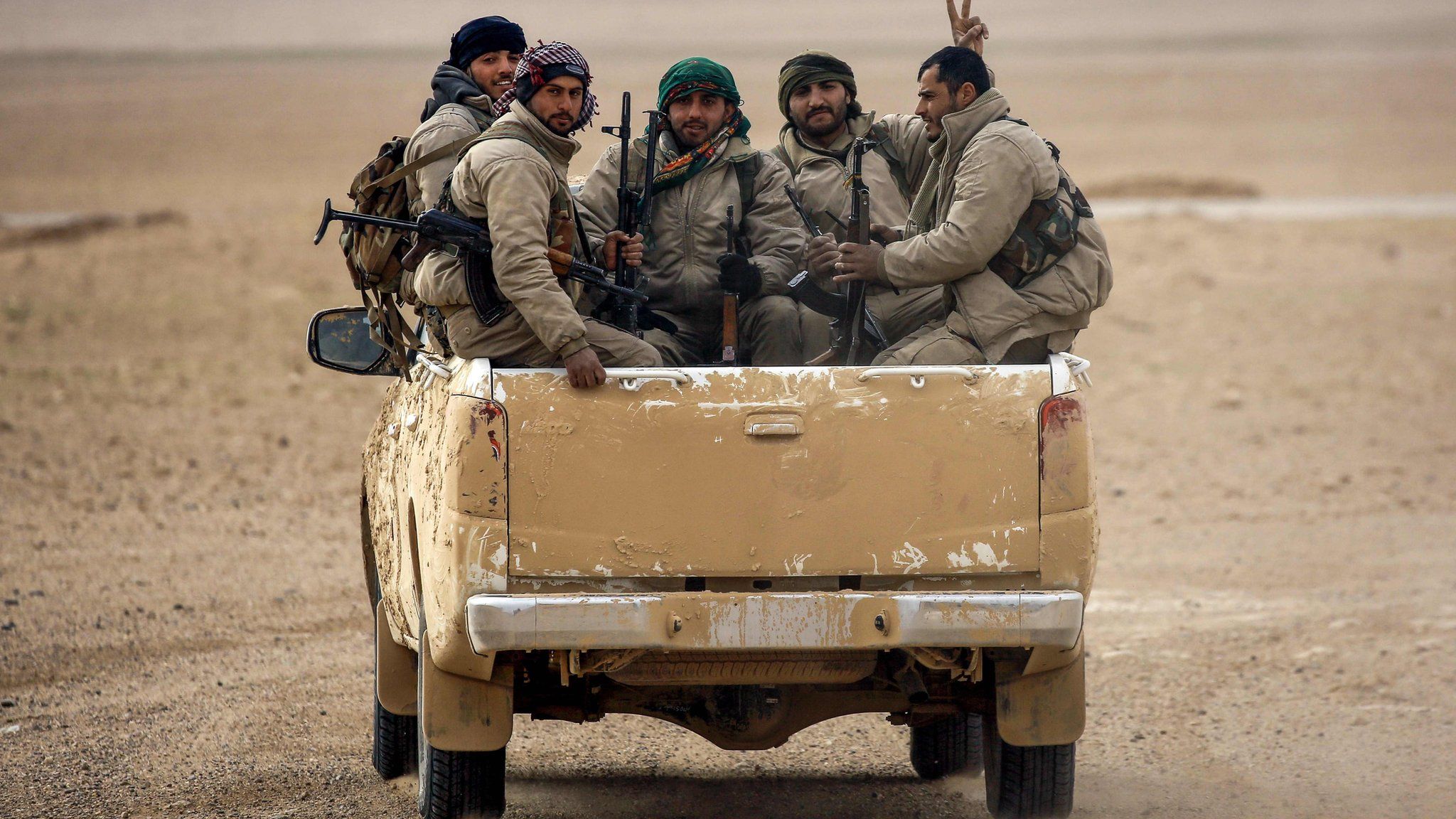 File photo shows members of the Syrian Democratic Forces (SDF) in vehicle north of Raqqa (8 February 2017)