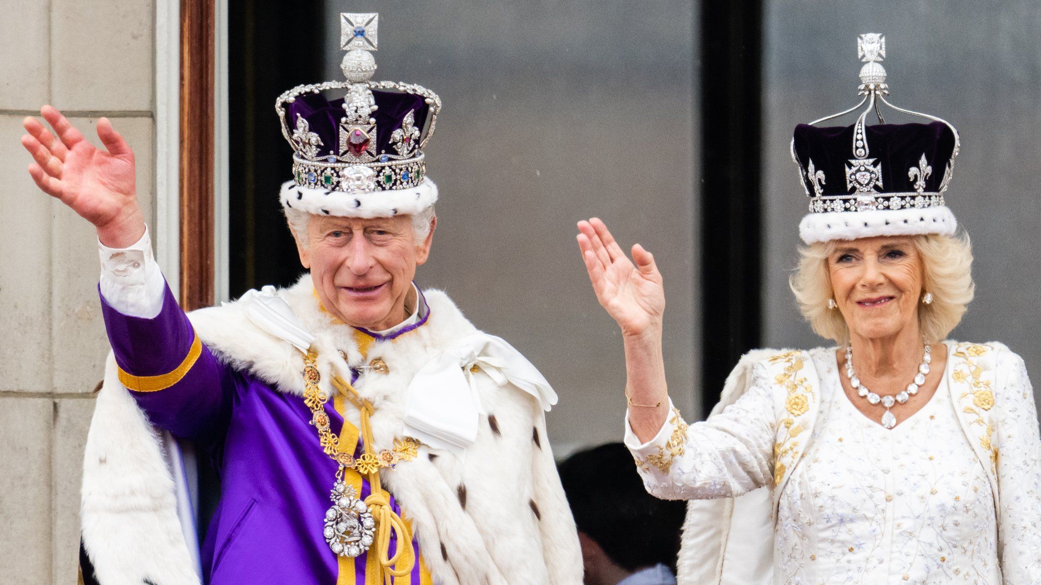 King Charles and Queen Camilla wave to crowds on the balcony of Buckingham Palace