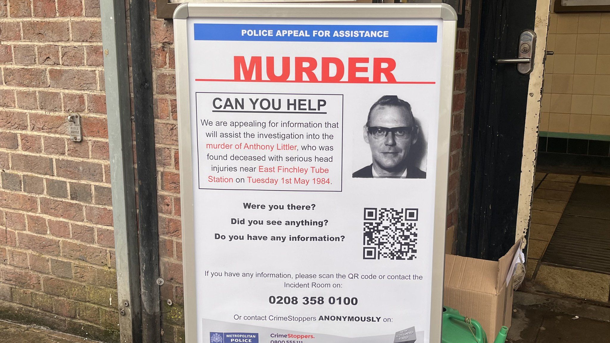 An appeal poster outside East Finchley Underground station asks anyone with information about the murder to contact the police