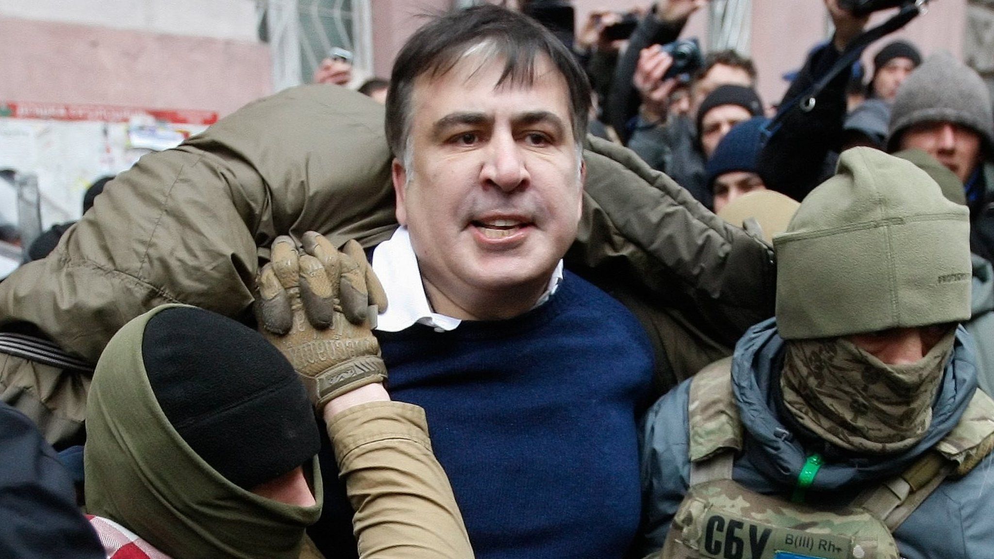 Ukrainian Security Service officers arrest the former Georgian president and ex-Odessa Governor Mikheil Saakashvili
